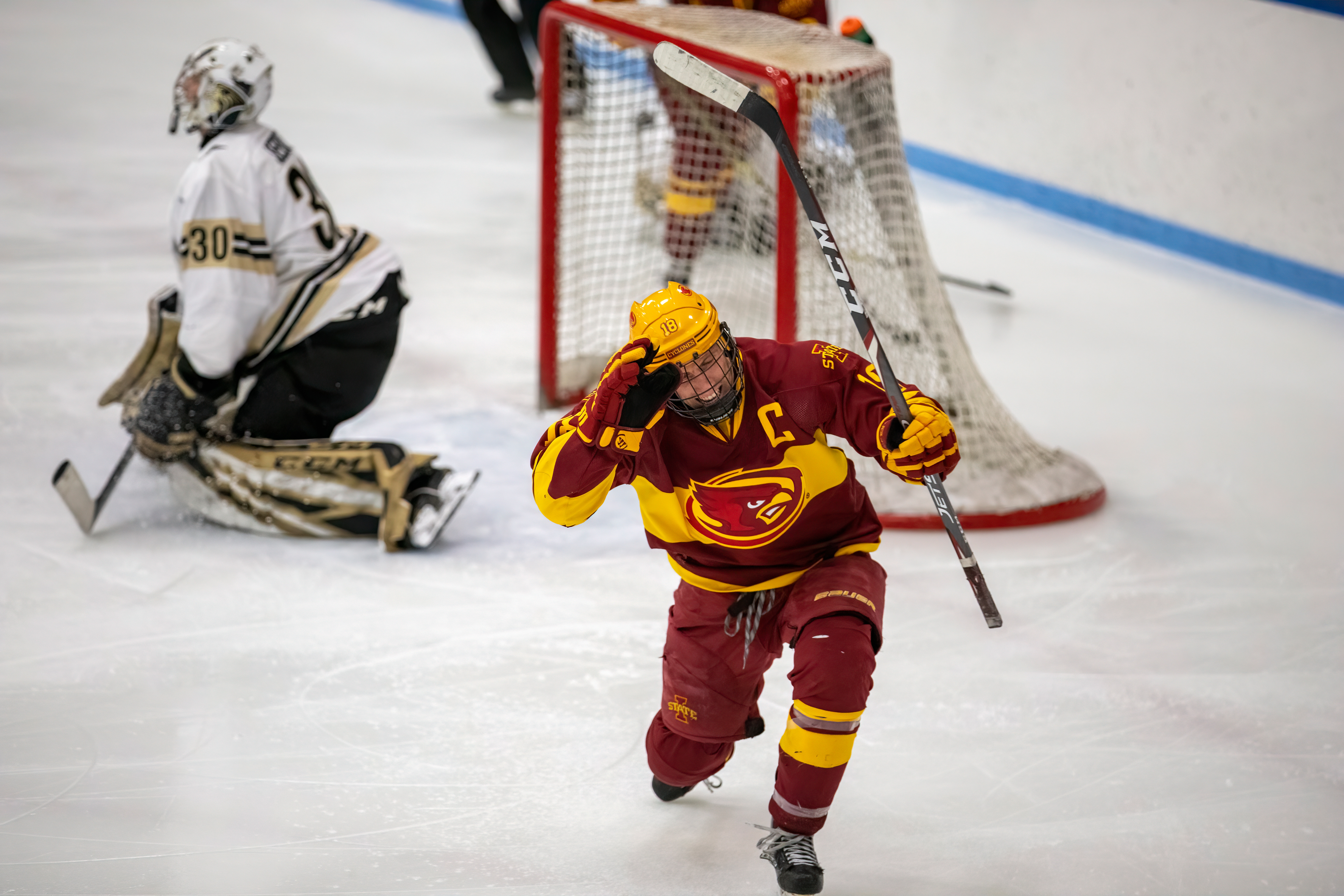 Captain Dylan Goggin (#18, Iowa State) celebrates after scoring a goal on Cooper Seedot (#30, Lindenwood).