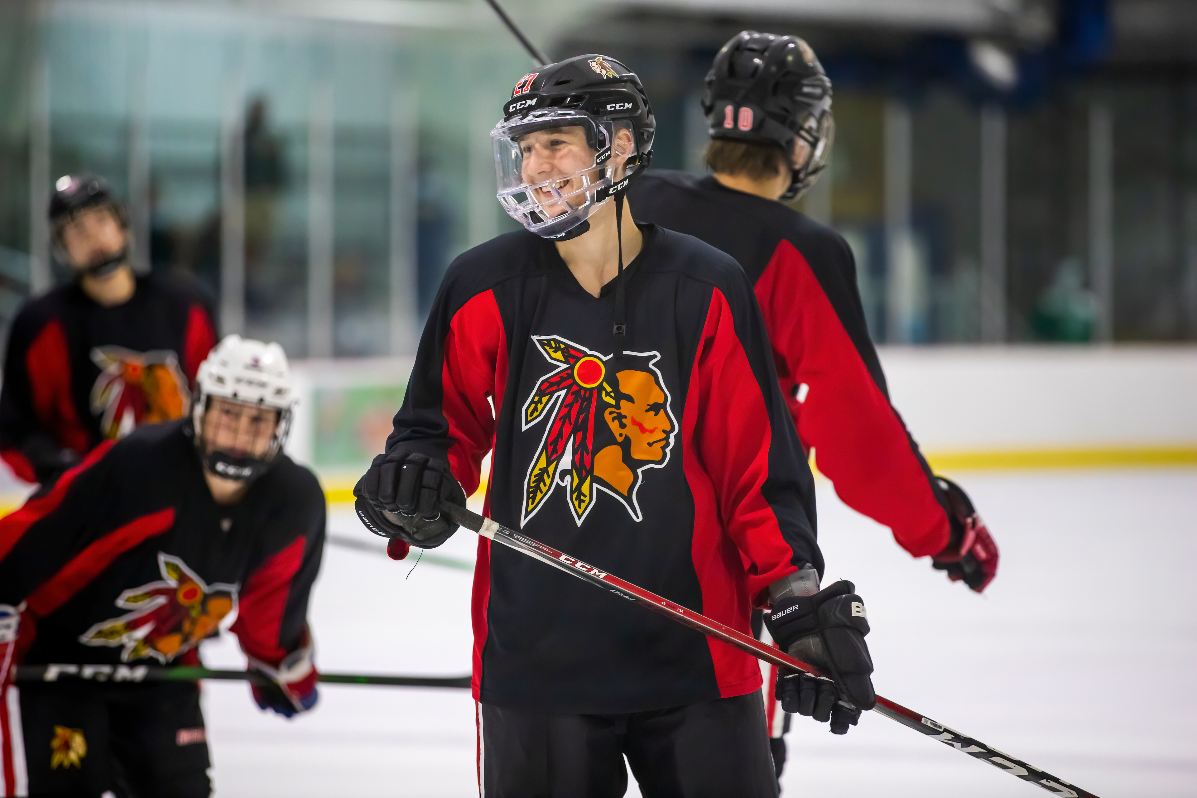 Evan Fassett (#27) smiles between plays.