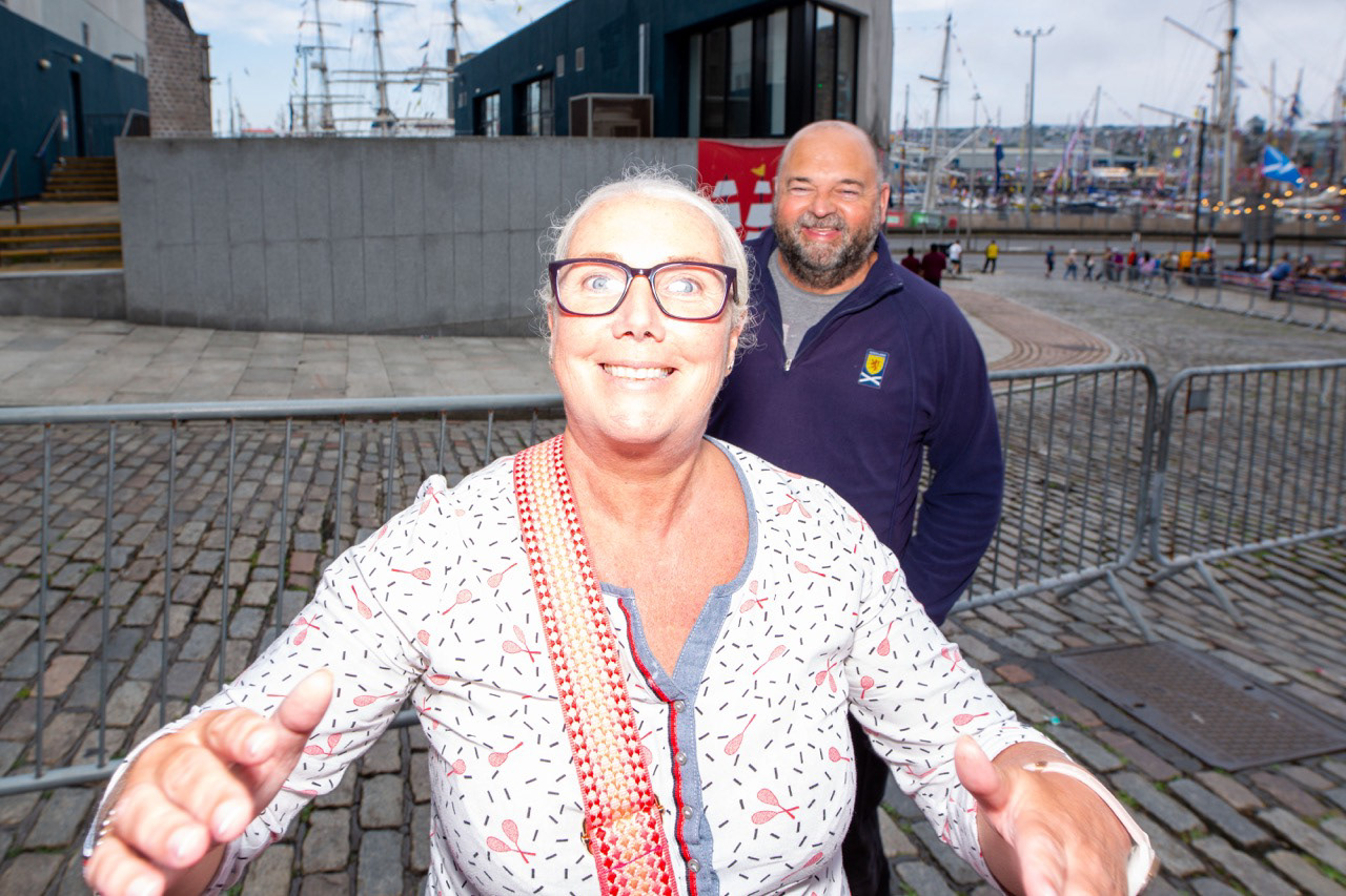 A warm Aberdeen welcome, locals pulling the photographer into the moment, not just the frame
