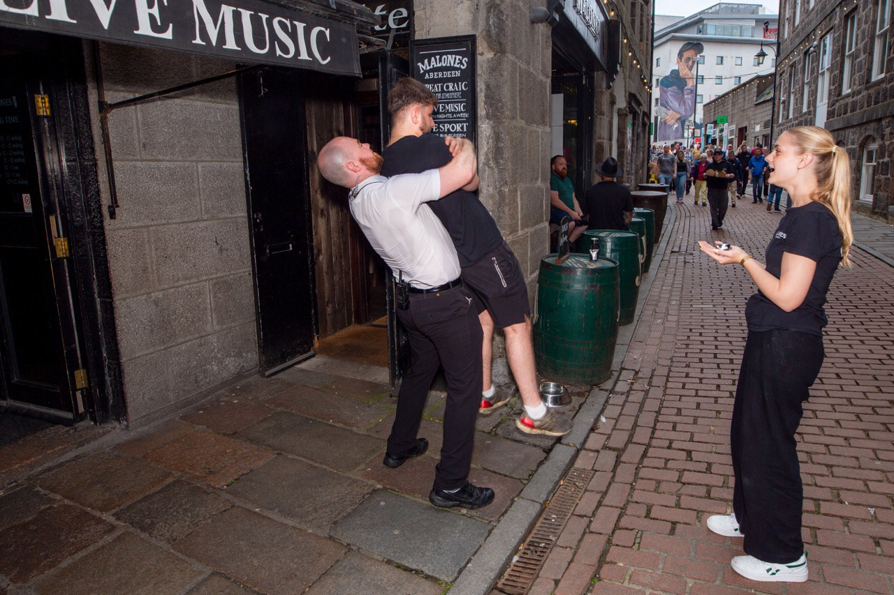 Aberdeen nightlife, mid-stretch. a doorman, one willing colleague, and a surprisingly professional chiropractic adjustment, no appointment required