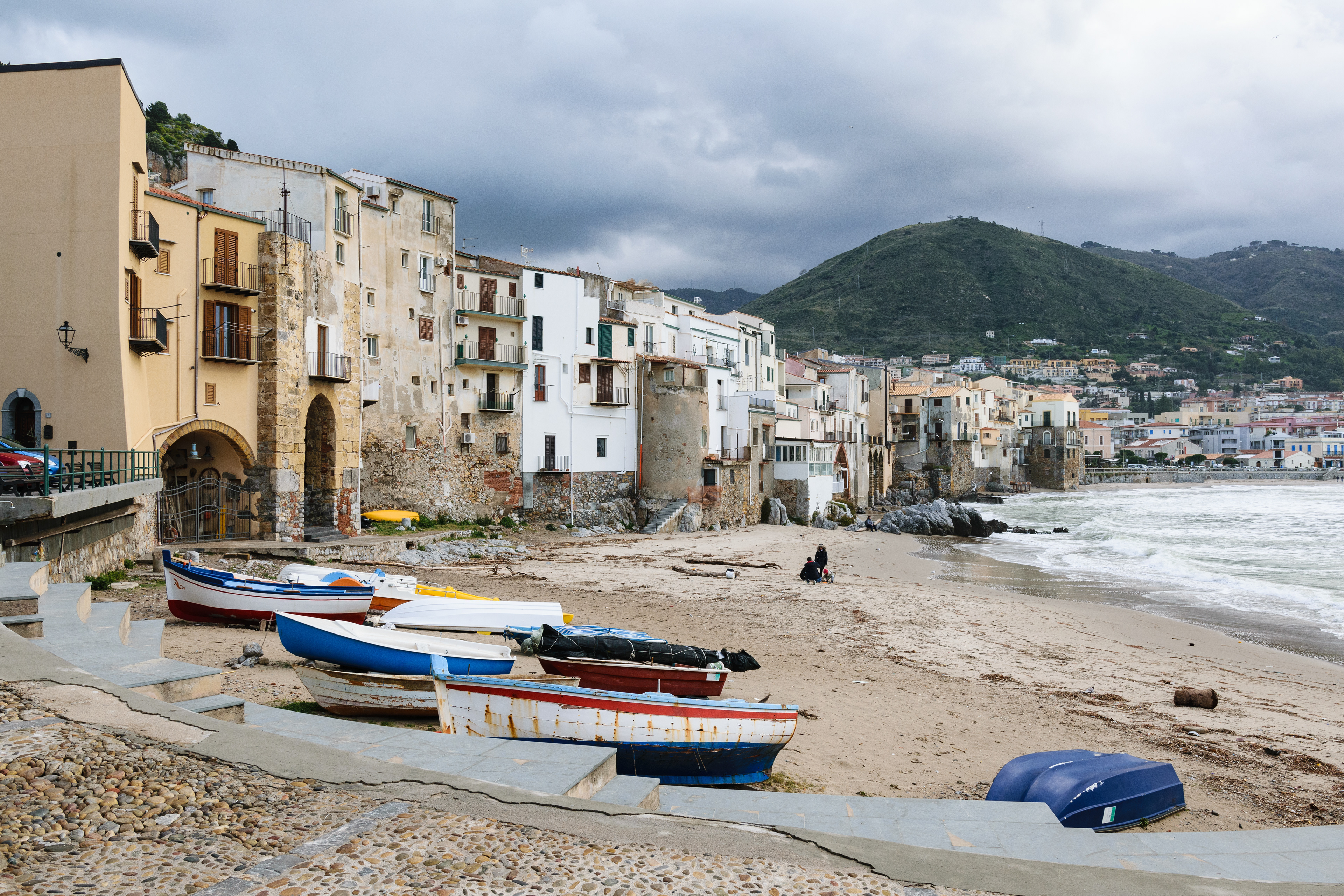 Boats and the old town of Cefaly, Sicily, Italy