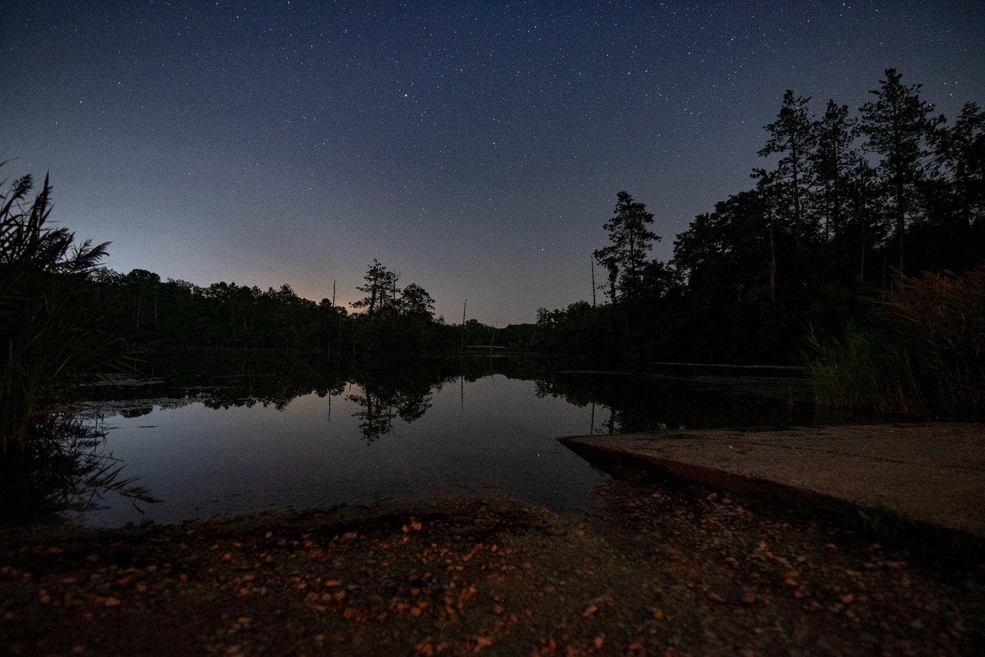 Still waters under a star filled sky