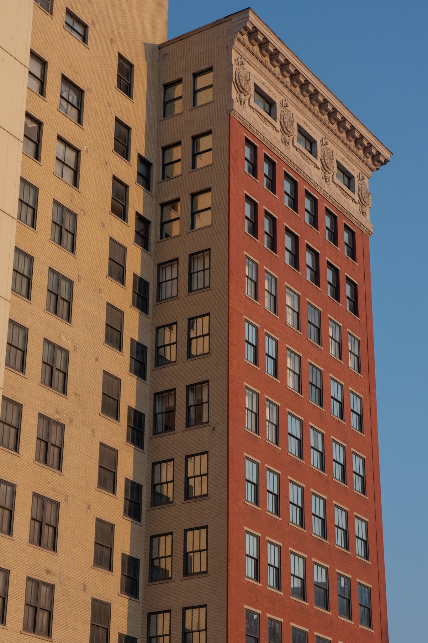 Morning sunlight illuminates a highrise building