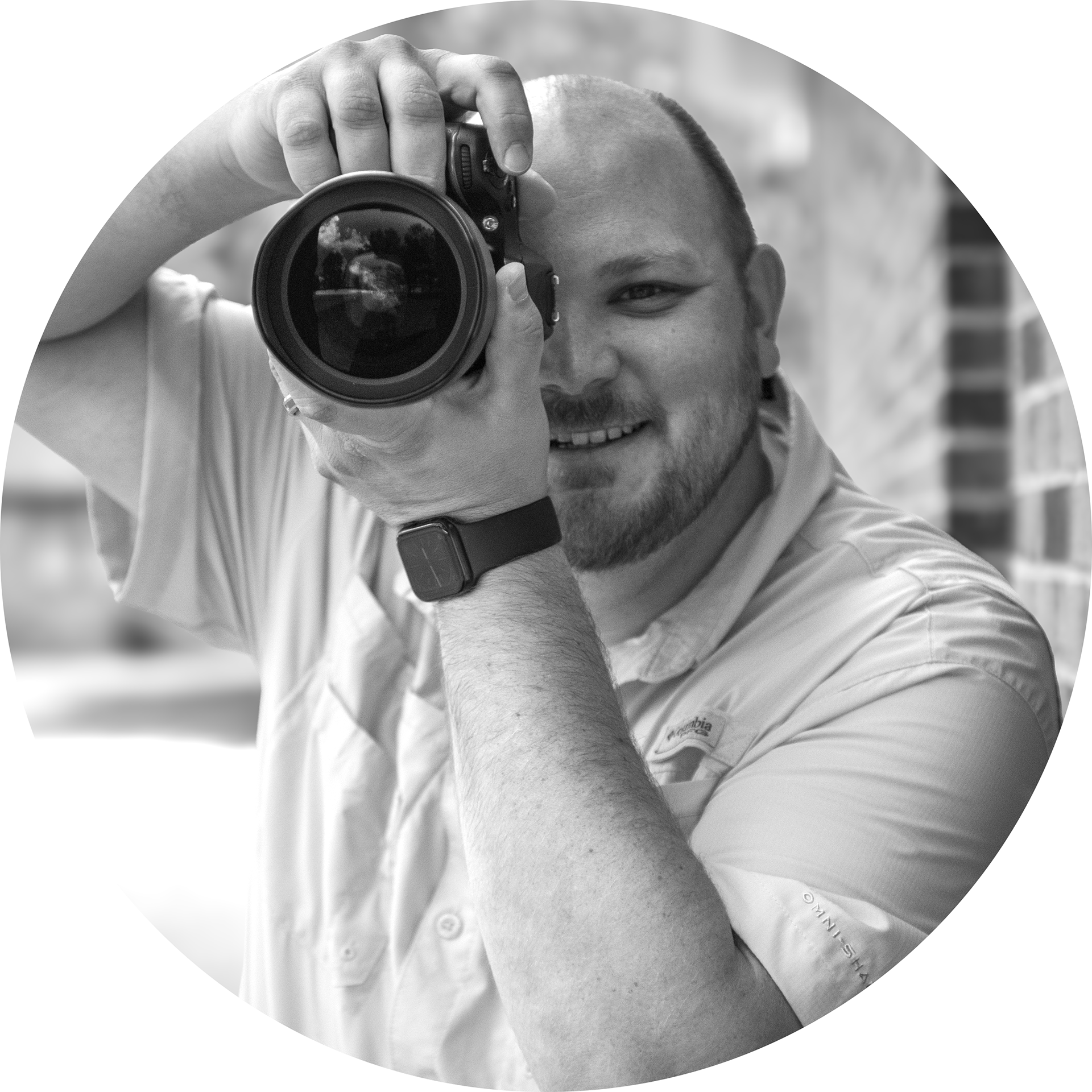 Portrait of Seth Passfield holding a camera