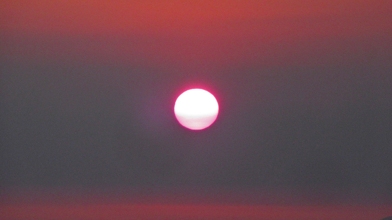 Sunset In Smoke-Filled Sky