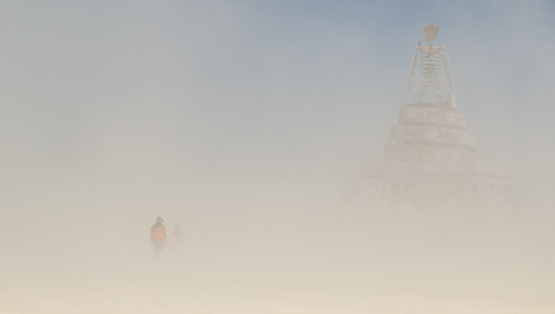 A self portrait near The Man. Dust storms frequently pop up so face coverings and goggles are necessary gear.