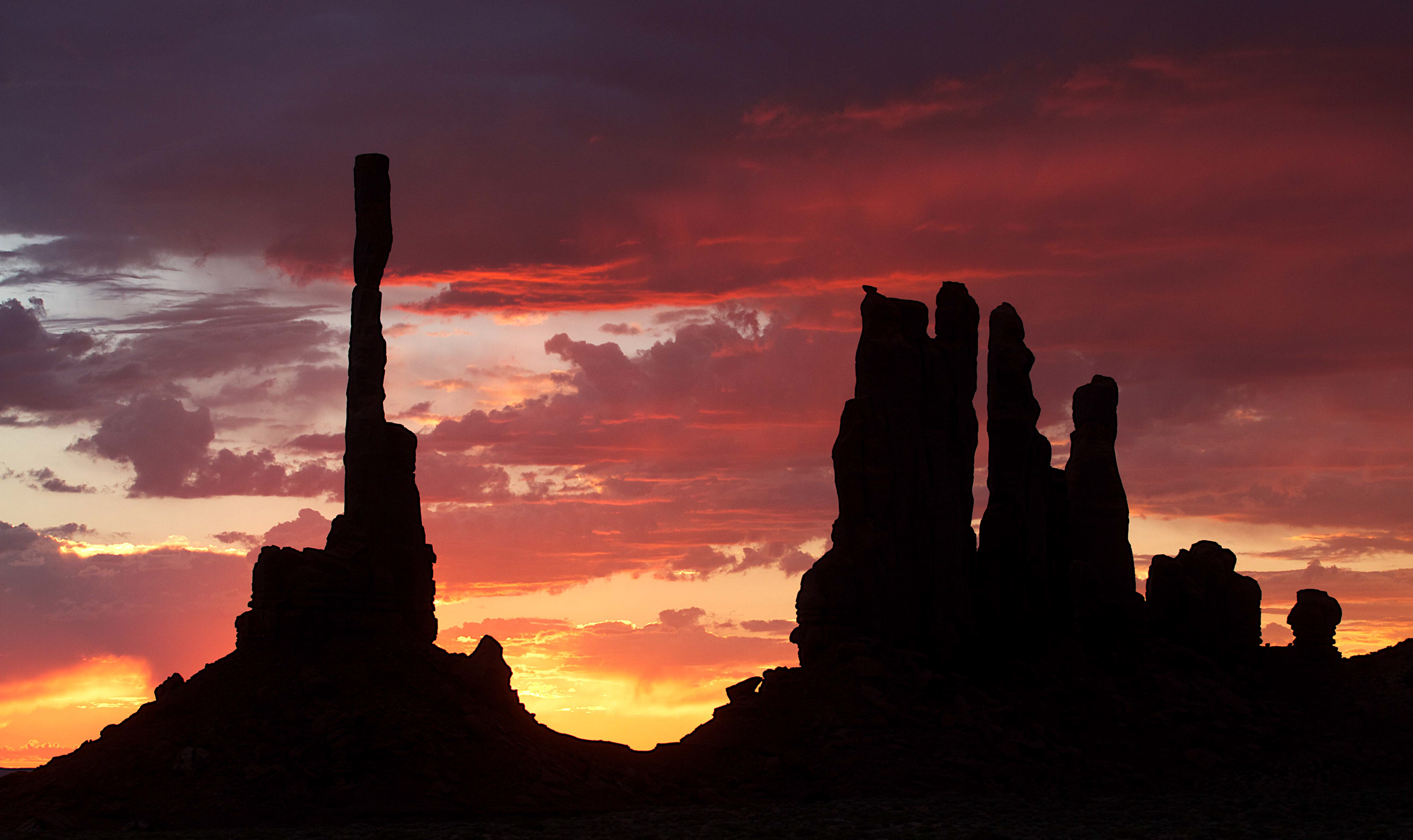 Totem Pole, left, and Yel-Bichel at sunrise. (Monument Valley, AZ)