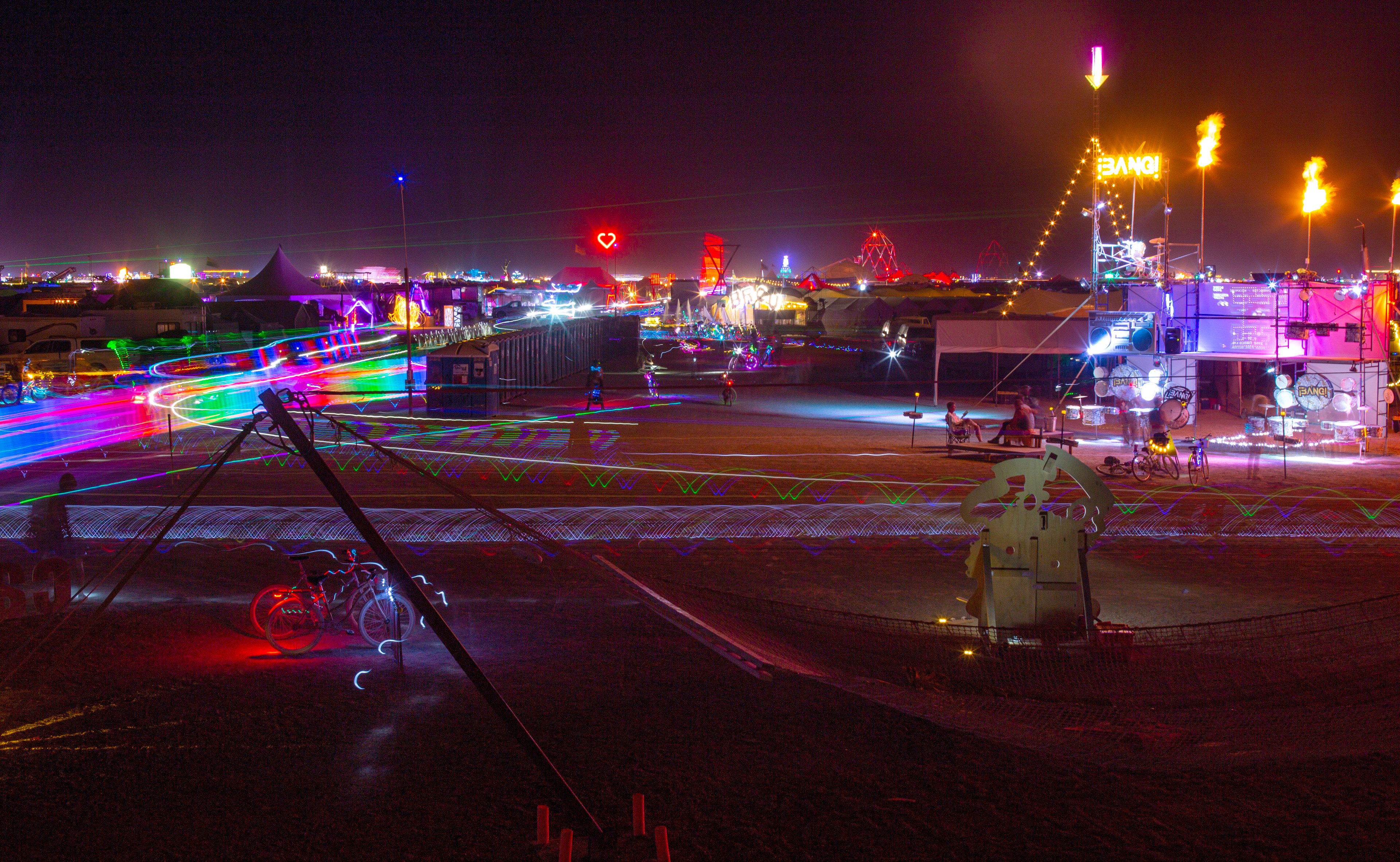 The camps light up at night.