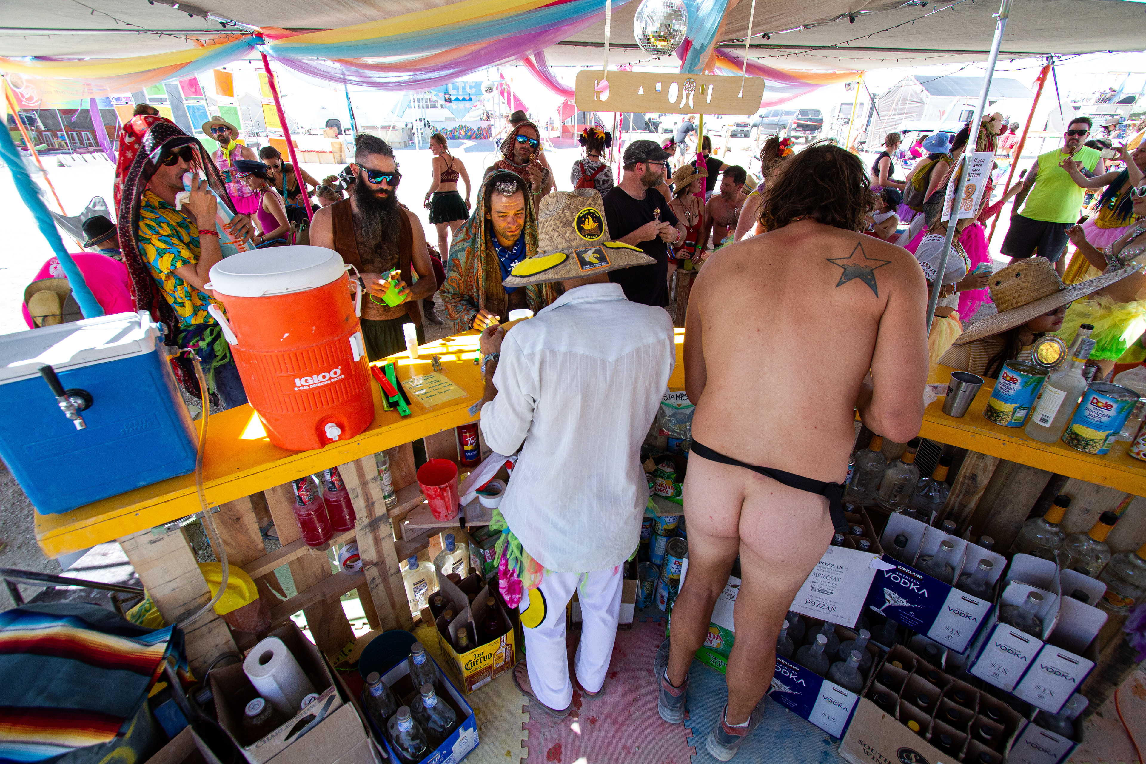 Burners line up at the bar for drinks during one of the many happy hours found throughout BRC.