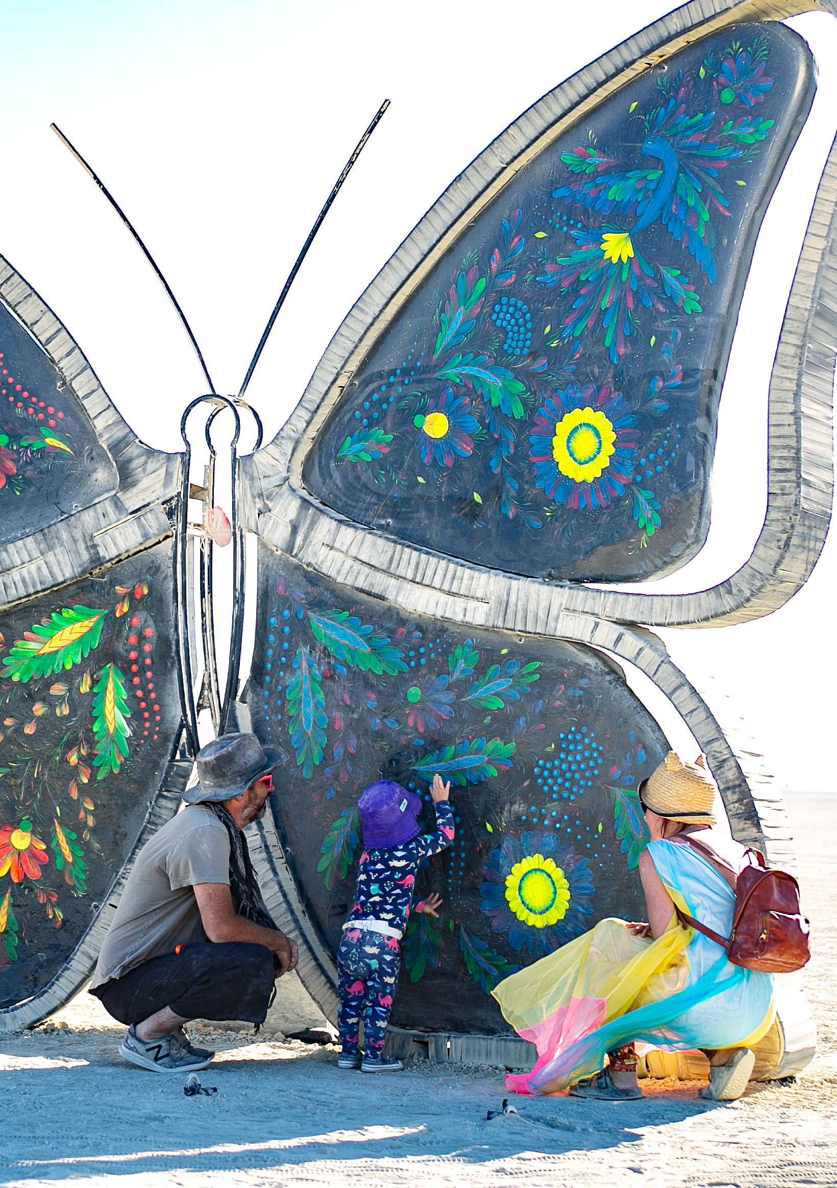 All ages are represented at Burning Man. Here parents show their toddler one of the art installations.