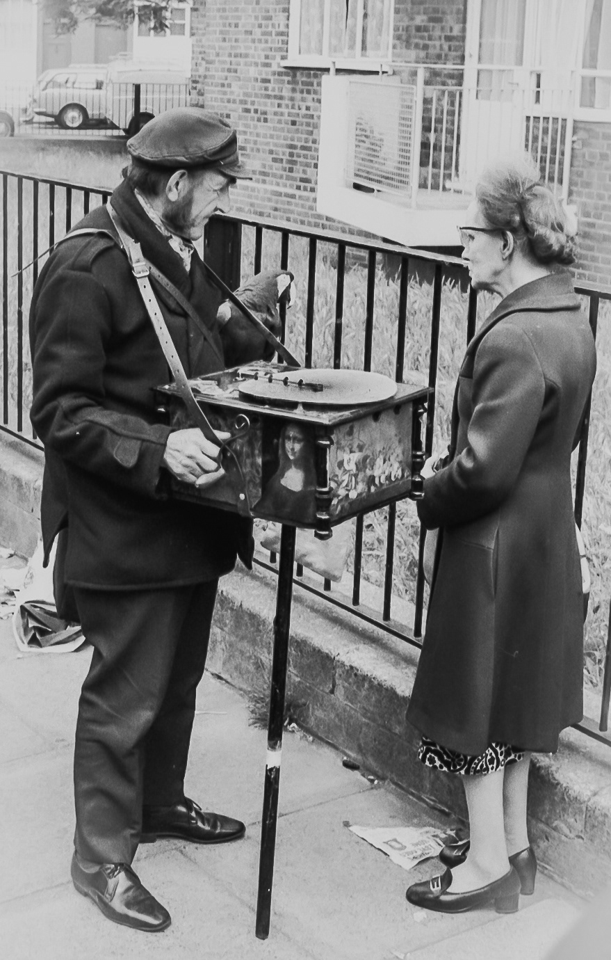 Man with musical box and parrot, London 1969