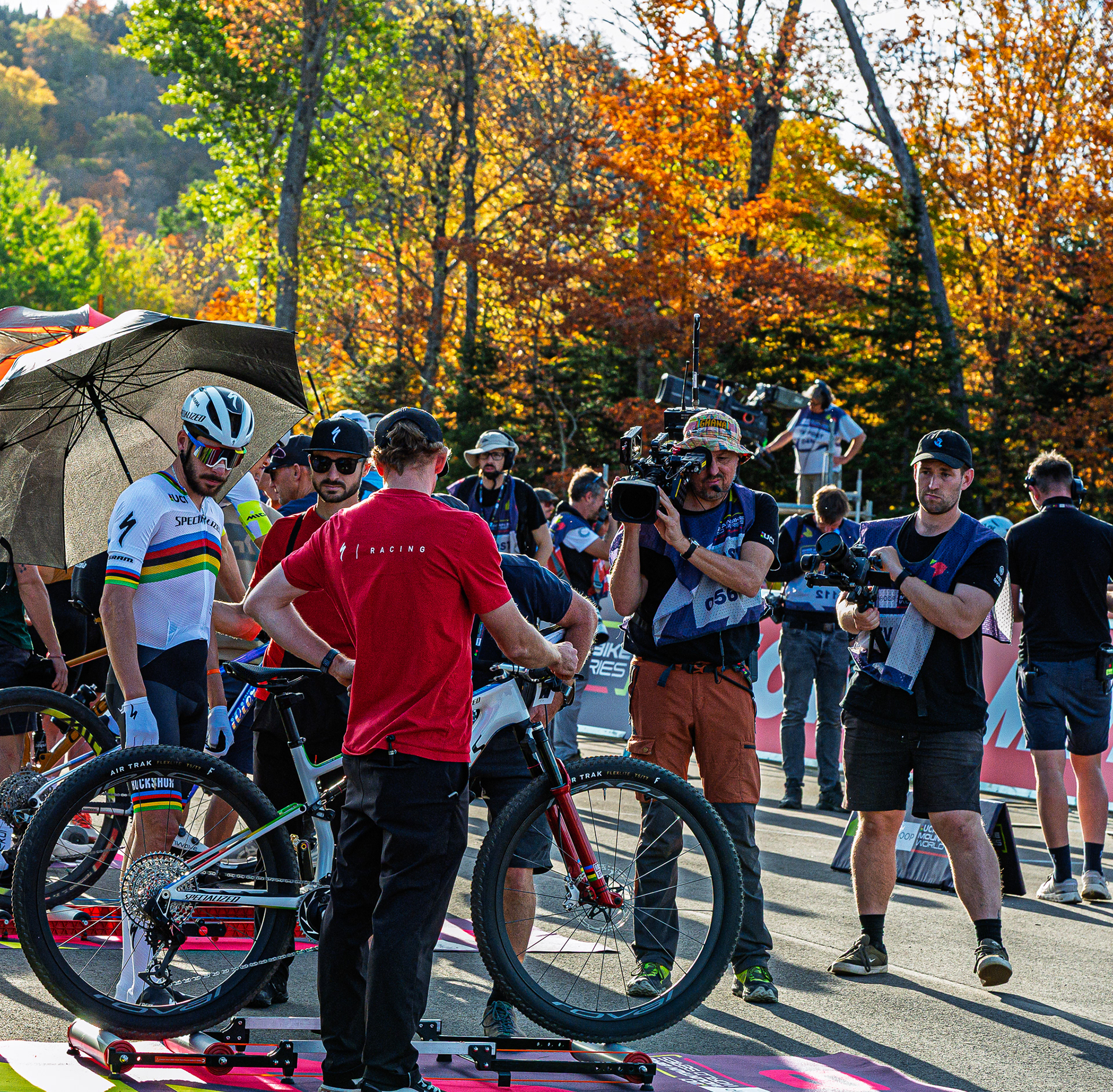 Rainbow Jersey Checking His Bike