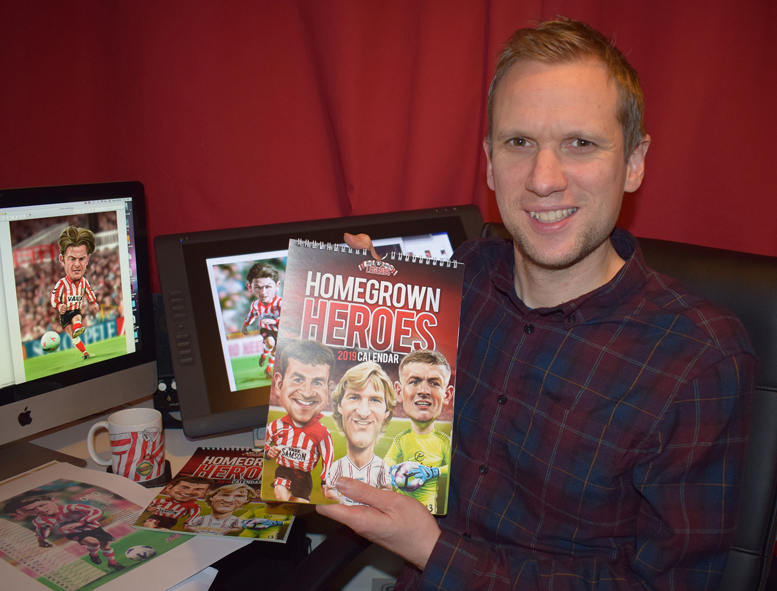 Artist and Illustrator Dave Wright - pictured with the Sunderland AFC Red and White Legends Calendar
