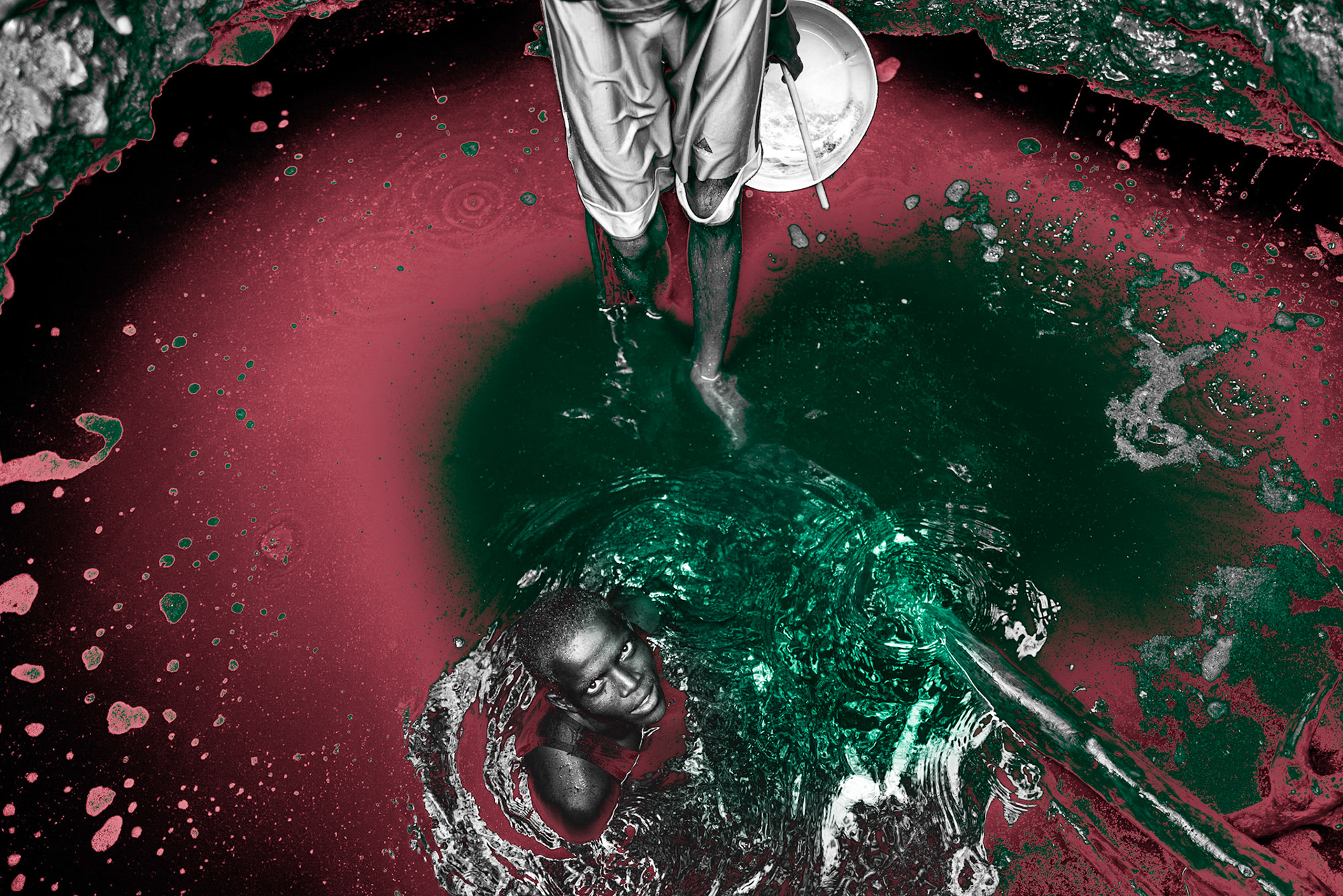 Men of the Gabra tribe are working in a well in Sabarei, located near the border of Ethiopia and Kenya. This traditional well provides water for livestock, but the water is not safe for human consumption. Despite the contaminated water, men pass water in a bucket from hand to hand while chanting.