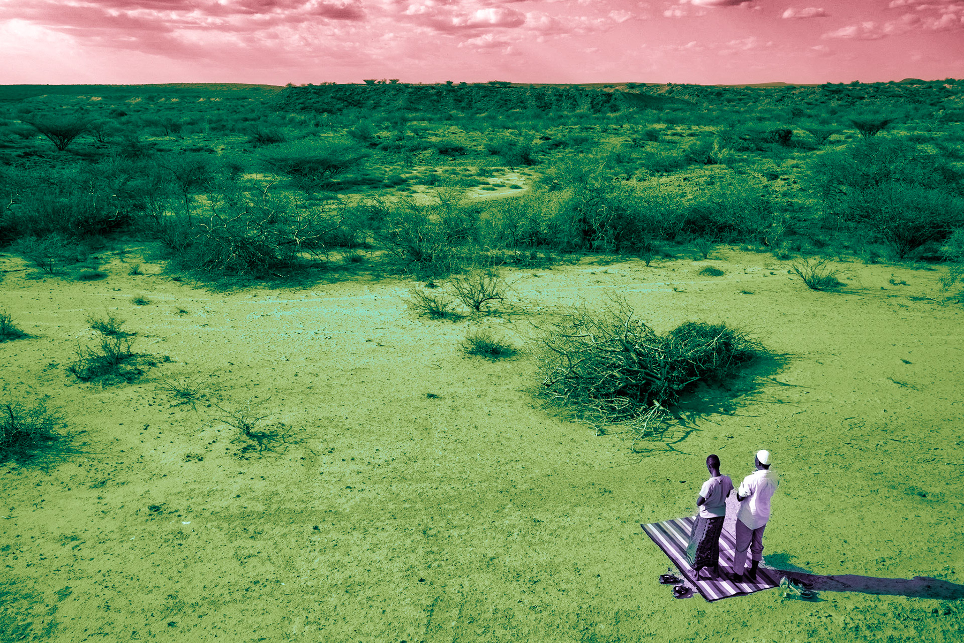 Two Somali men are praying on the road from Selicho to Marsabit, a journey that takes around 20 hours through the desert. They are driving a truck loaded with dried fish and travelling up to Busia at the border of Kenya and Uganda. There, the fish will be sold for the final destination market, the Democratic Republic of Congo.