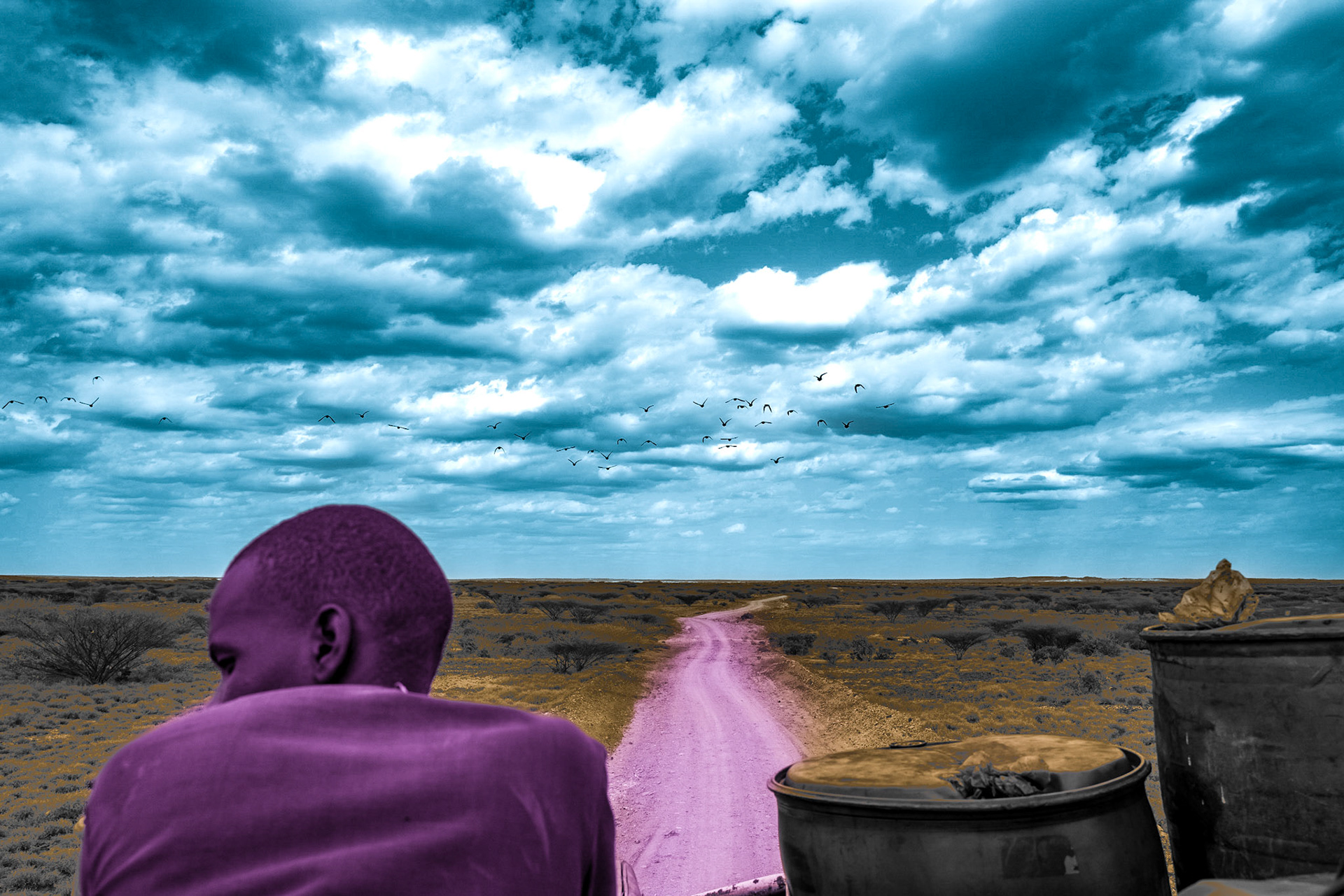 A man sits on the roof of a truck loaded with dried fish from Lake Turkana. The war in Ukraine has caused a spike in fuel prices in Kenya, which is why the truck is carrying two barrels of diesel from Ethiopia. To avoid the police, the truck also drives without lights during the night after the curfew imposed due to a tribal conflict.