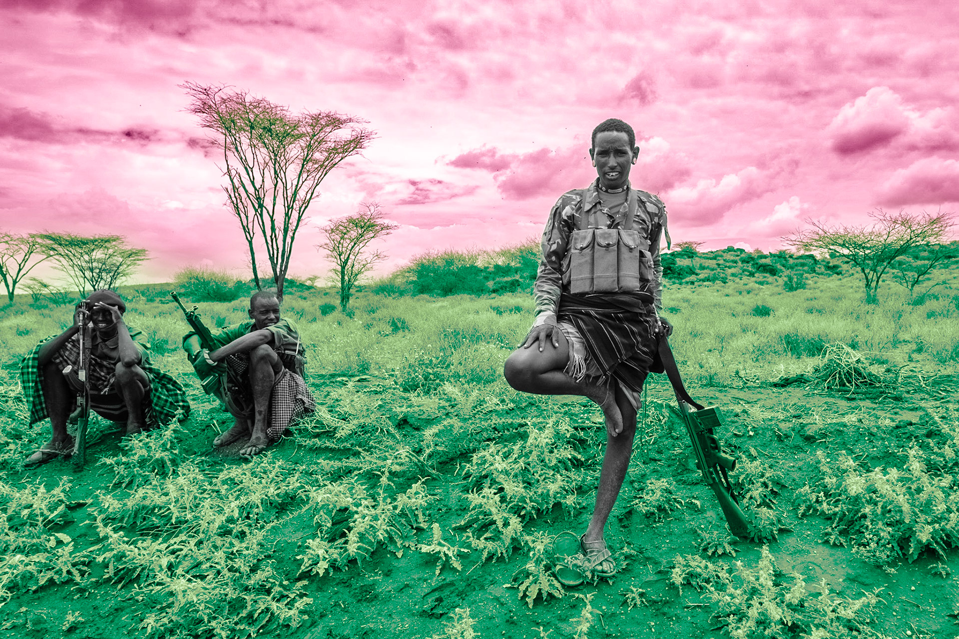 Three Samburu Moran(warriors) armed with G3 rifles are standing along the road from Suiyian to Baragoi. A week ago, three other Samburu were killed by Turkana in this area. The conflict between Samburu, Turkana and other neighboring communities has been escalating.