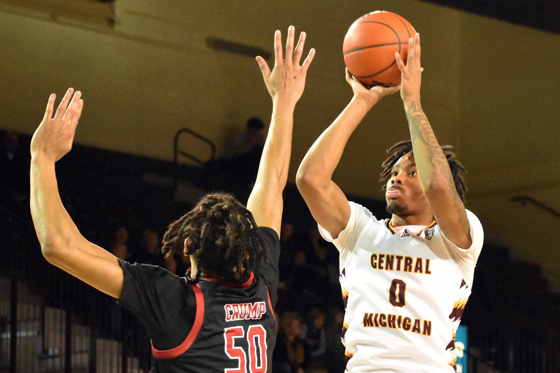 Senior guard Brian Taylor shoots over Northern Illinois' Anthony Crump during a game Saturday, Feb. 25 in McGuirk Arena. Taylor was the second leading scorer of the game with 14 points.
