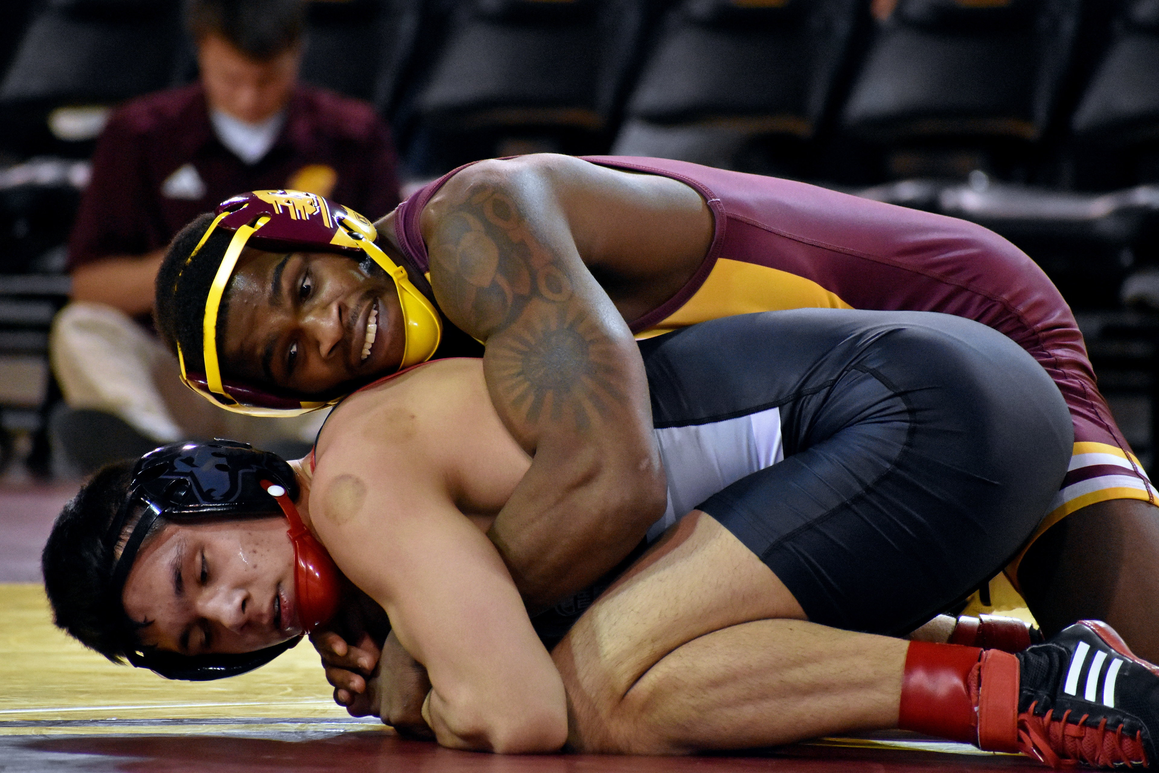 Miami redshirt junior Johnny Lovett wrestles Kavan Troy during a match against Northern Illinois University Friday, Jan. 13 in McGuirk Arena. Lovett won the matchup 15-7.