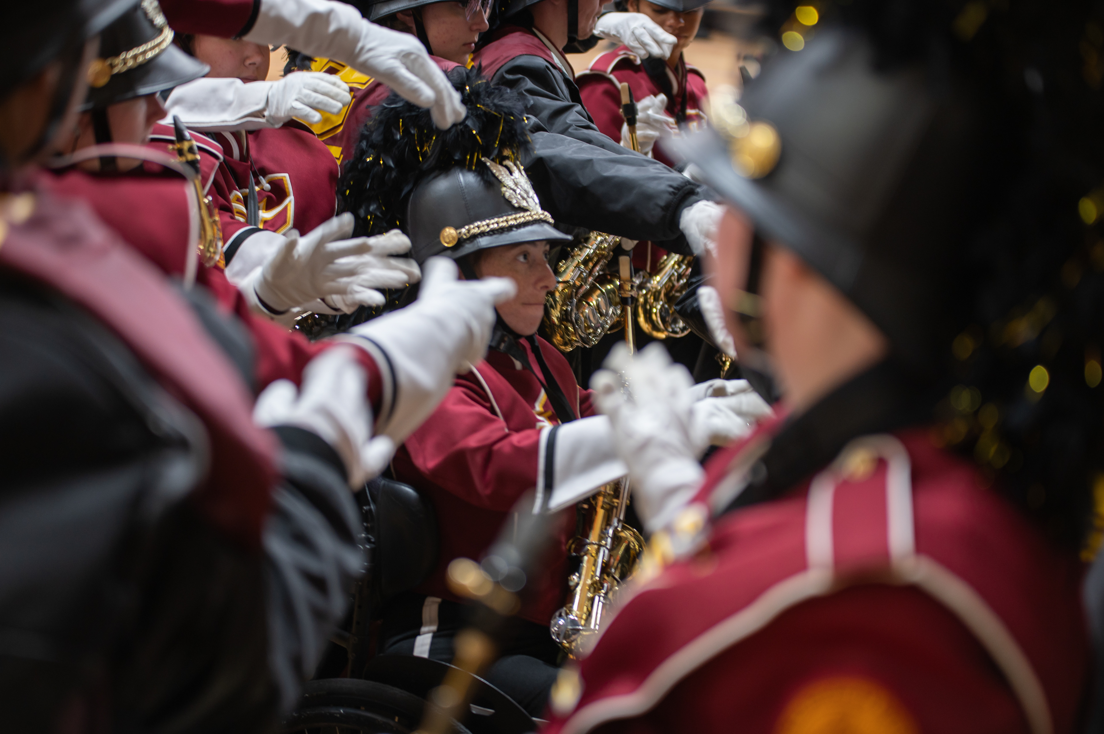 The Chippewa Marching Band’s alto saxophones huddle around Gaia in the Student Activity Center, on the campus of Central Michigan University, Mount Pleasant, Michigan, Tuesday, October 31, 2023. The group was getting ready to head out to the field.