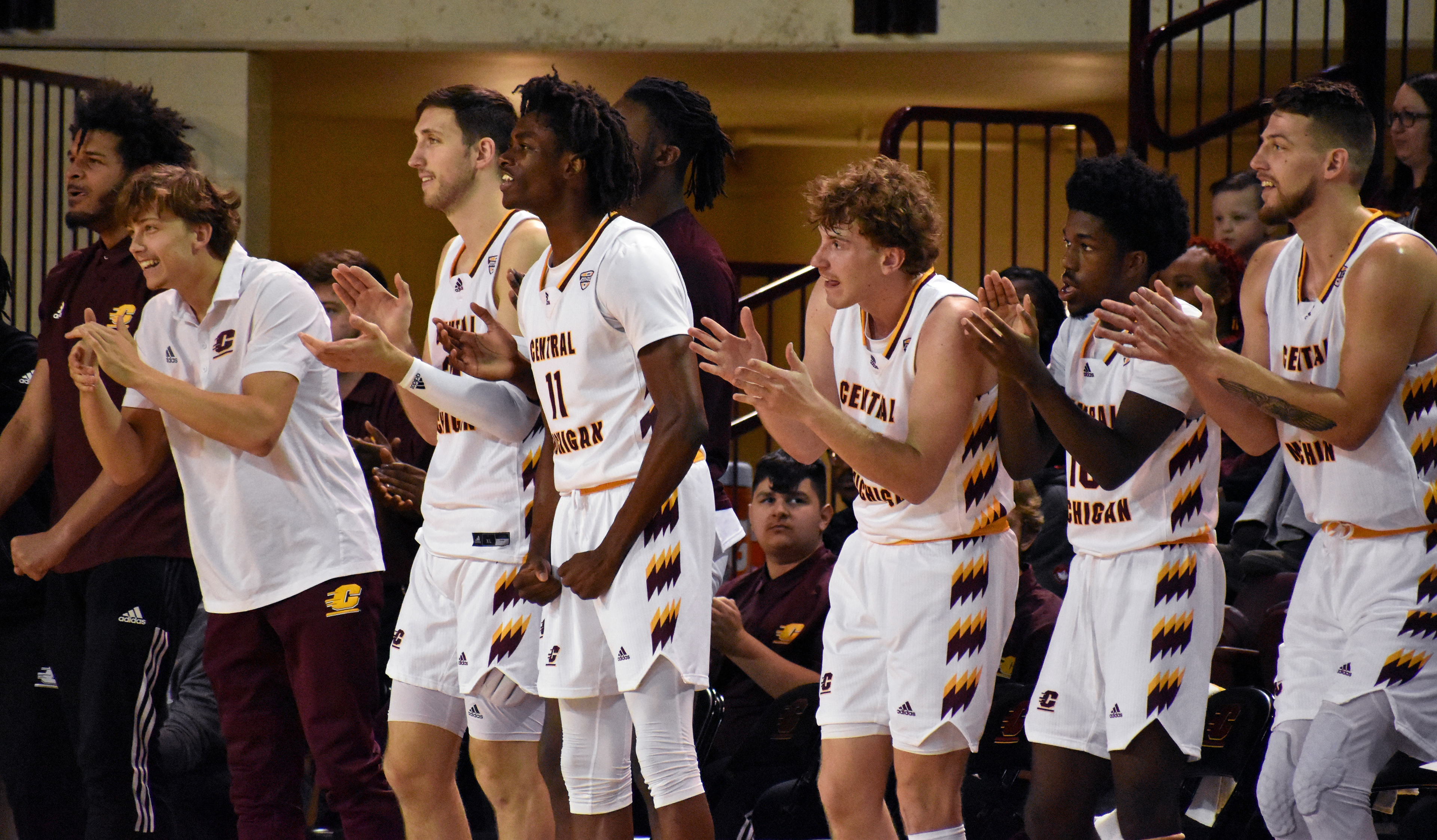 CMU's bench celebrates during a game against Alma on Saturday, Dec. 3 in in McGuirk Arena.