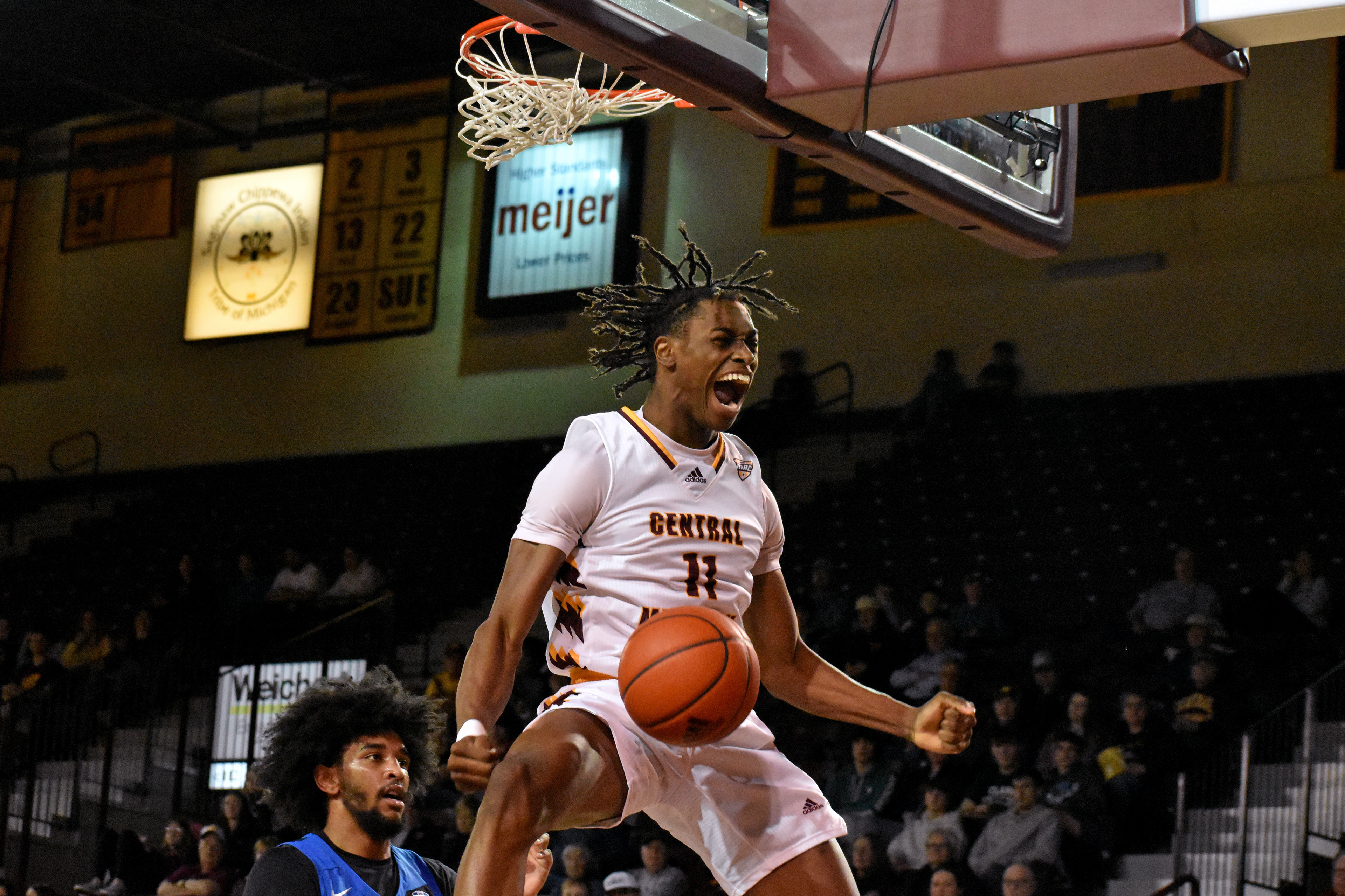 Freshman forward Ola Ajiboye celebrates after a dunk during a game against Buffalo Saturday, Jan. 14 in McGuirk Arena. Ajiboye played 22 minutes and had five points and rebounds.