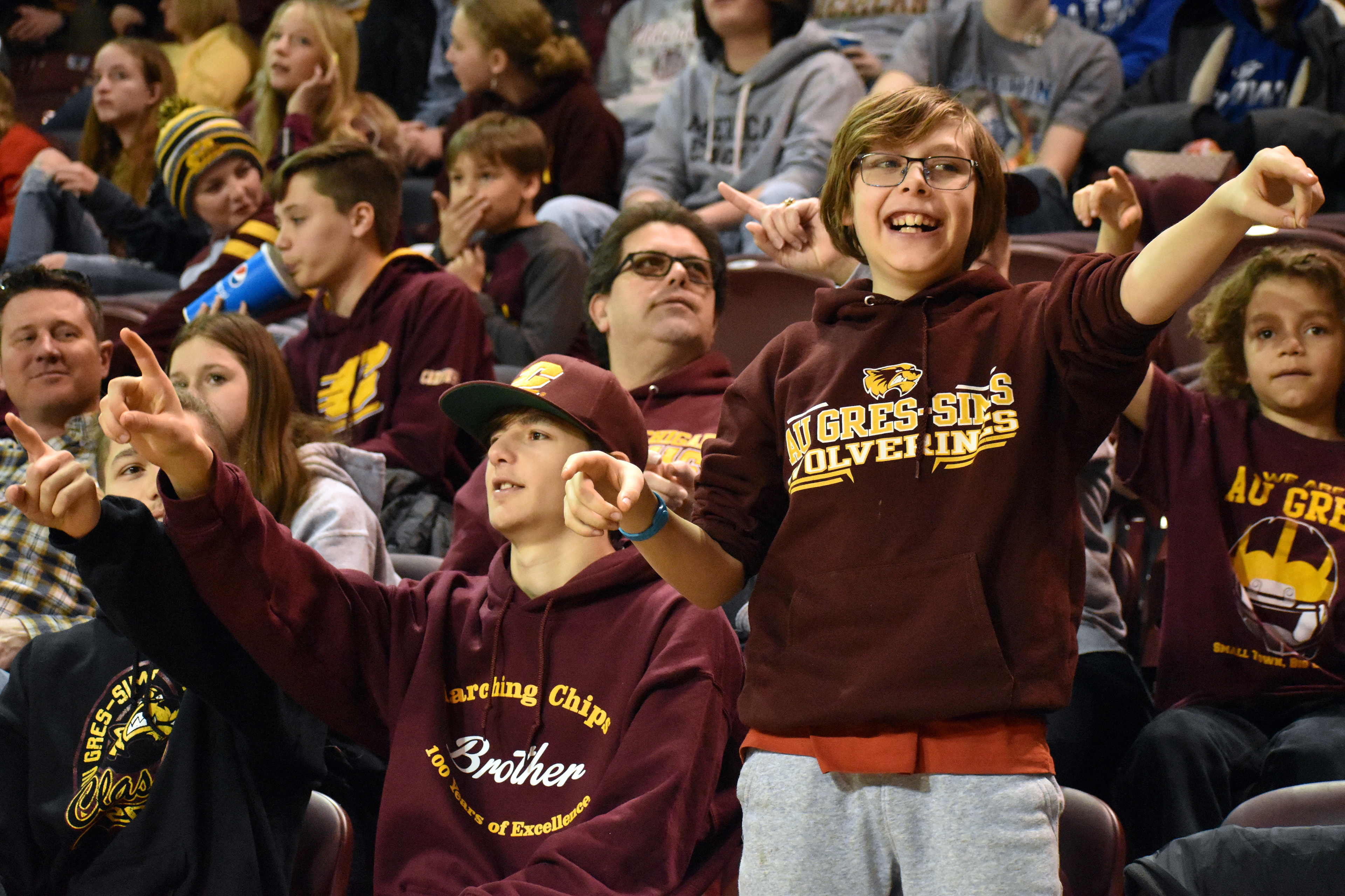 Collin Verdusco (right) dances to the YMCA during CMU's game against Northern Illinois Saturday, Feb. 25 in McGuirk Arena.