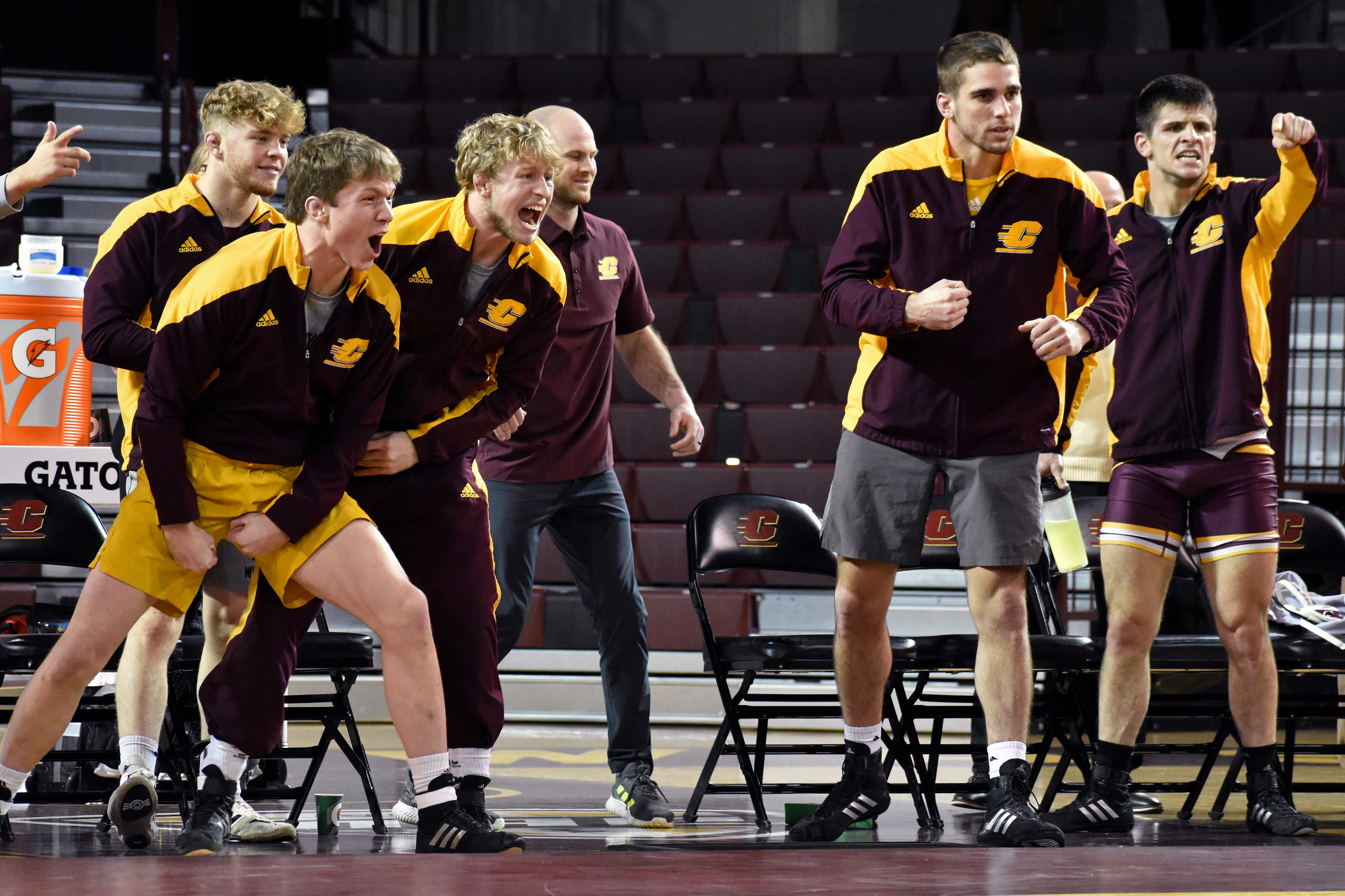 CMU wrestlers celebrate during a match against Northern Illinois University Friday, Jan. 13 in McGuirk Arena.