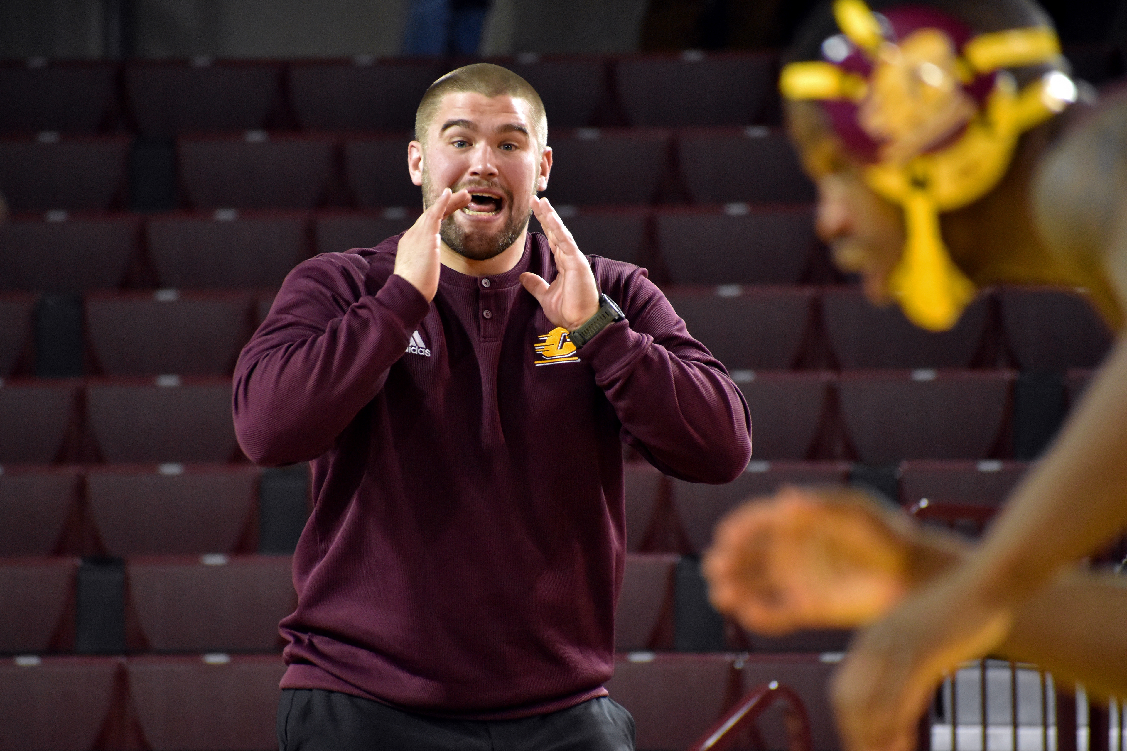 Volunteer assistant coach Matt Stencel talks to Miami redshirt junior Johnny Lovett during a match against Northern Illinois University Friday, Jan. 13 in McGuirk Arena.