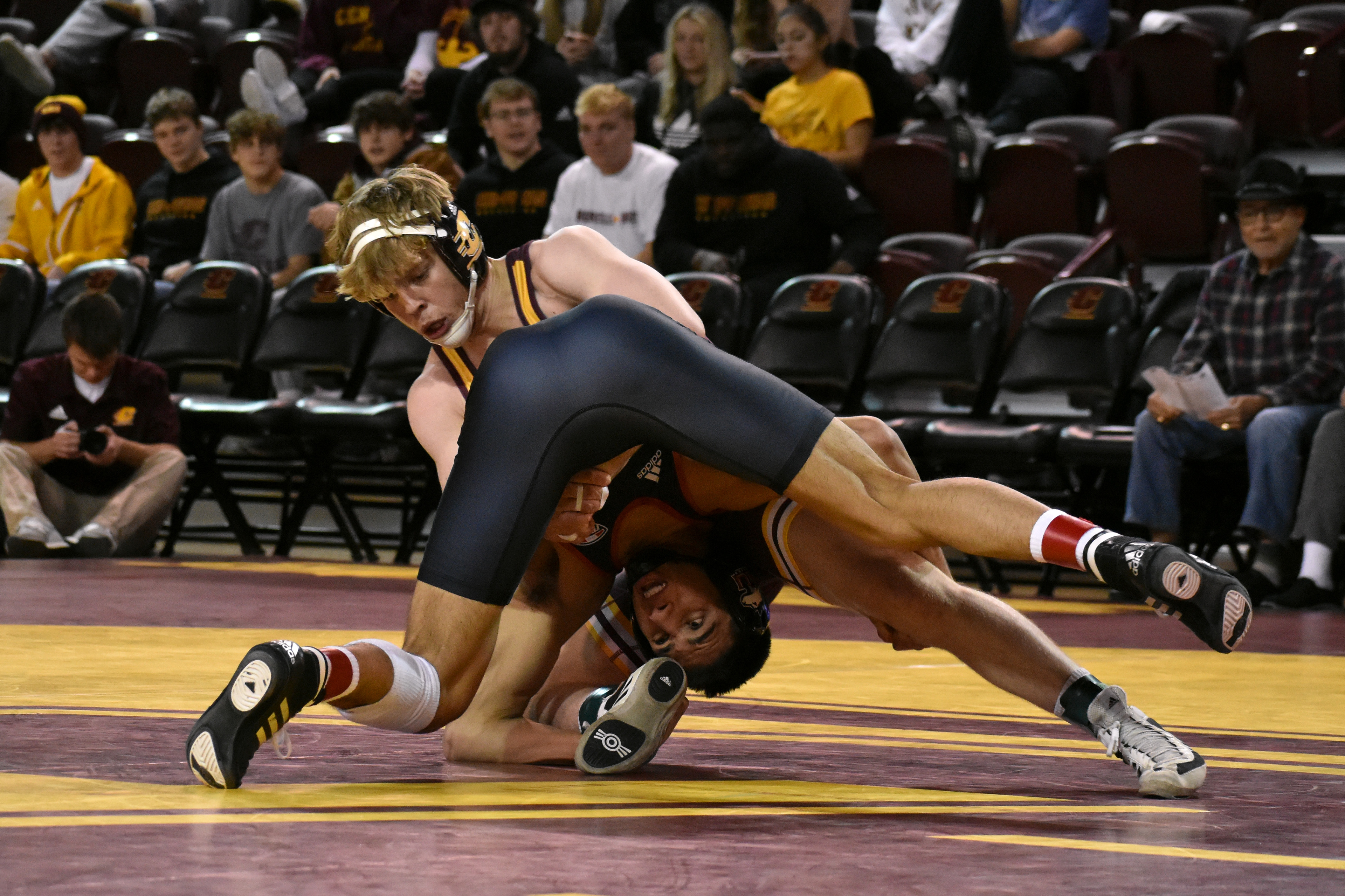 Darien freshman Jimmy Nugent wrestles during a match against Northern Illinois University Friday, Jan. 13 in McGuirk Arena. CMU defeated Northern Illinois University 23-18.