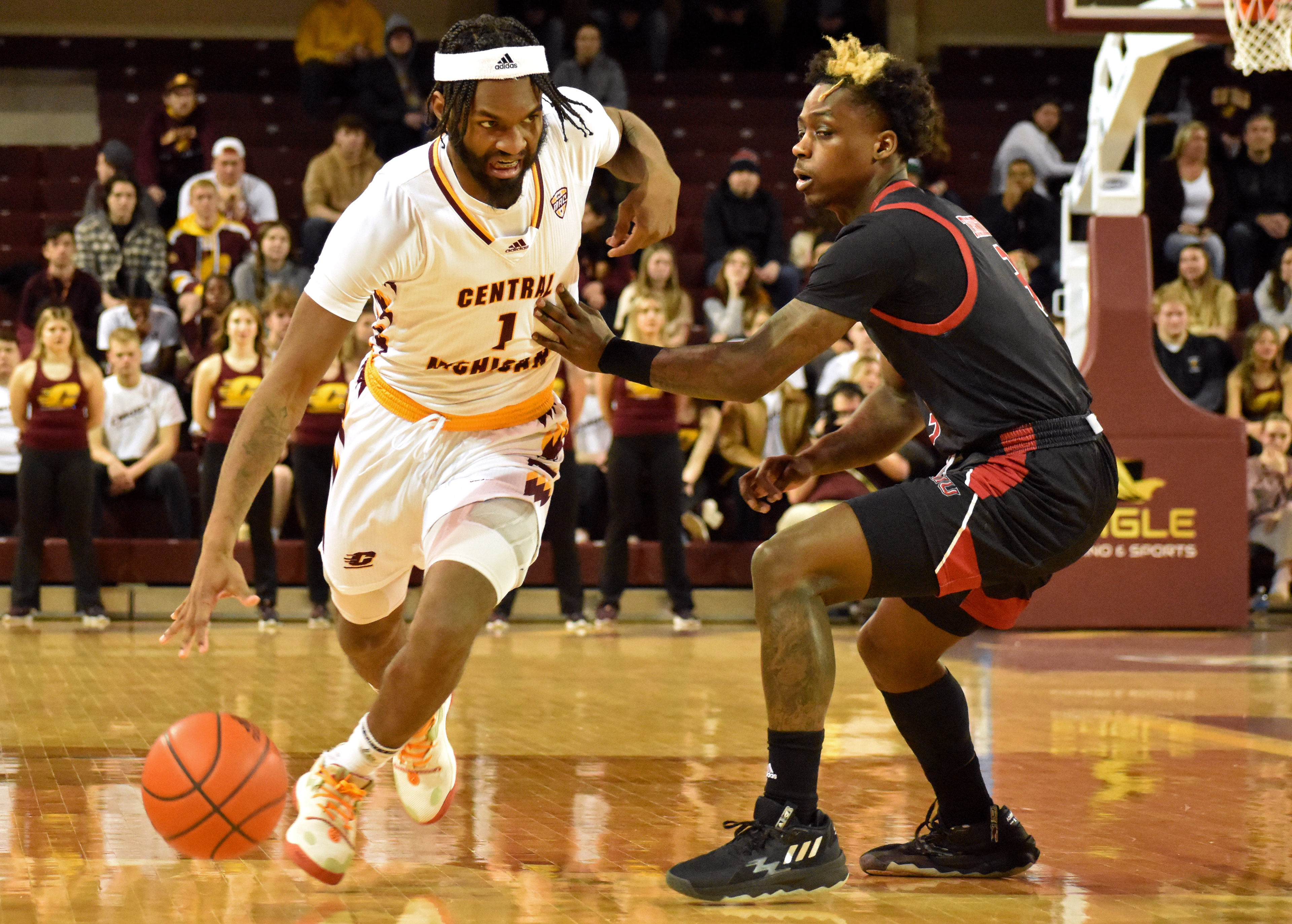 Freshman guard Reggie Bass drives against Northern Illinois' Kaleb Thornton during a game Saturday, Feb. 25 in McGuirk Arena. Bass scored a career and game-high 40 points.