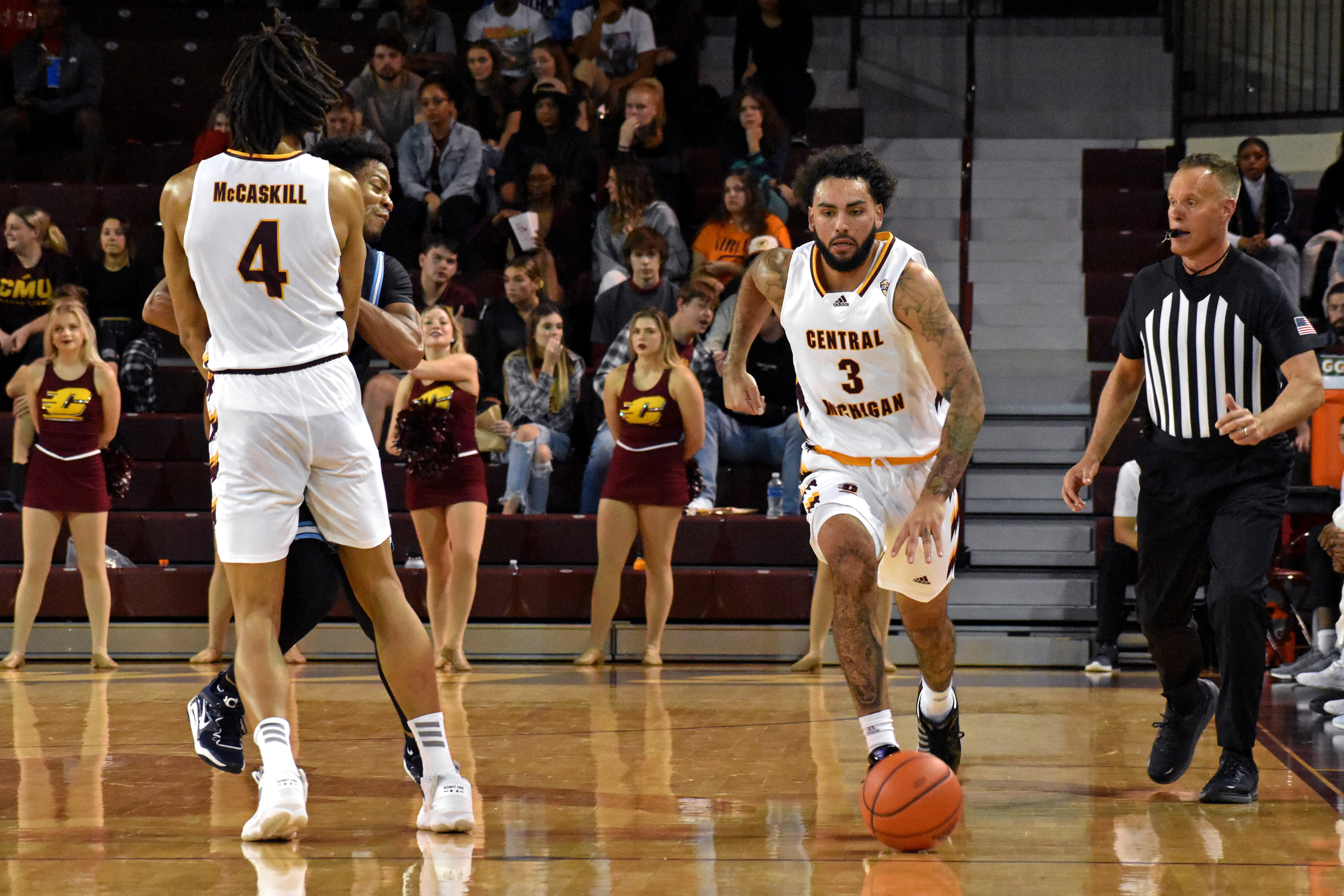 (From left) Junior forward Carrington McCaskill sets a pick while junior guard Jesse Zarzula takes the ball up the court during CMU's exhibition game against Northwood Thursday, Nov. 3 in McGuirk Arena.