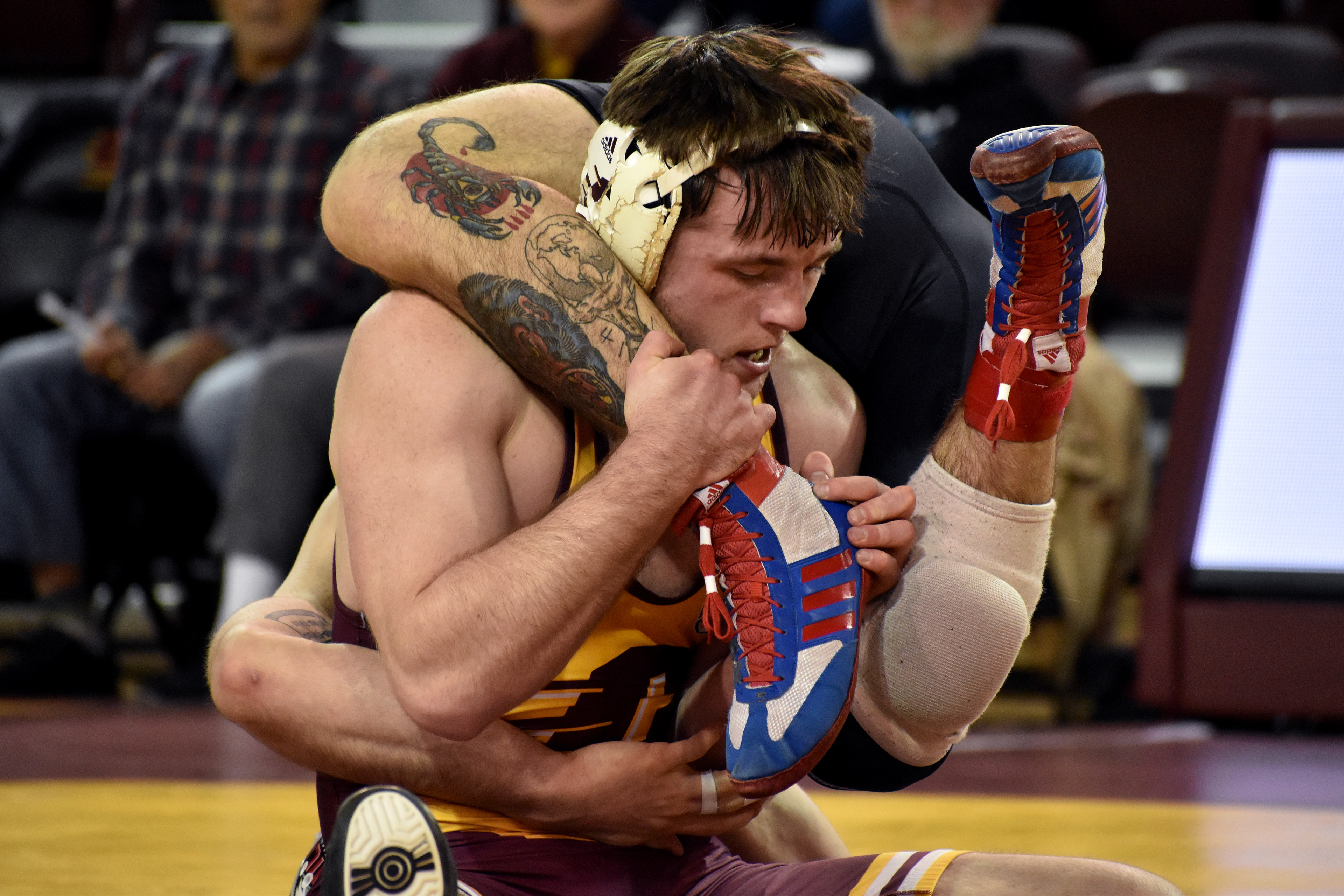 Grayslake redshirt junior Alex Cramer wrestles Hayden Pummel during a match against Northern Illinois University Friday, Jan. 13 in McGuirk Arena.