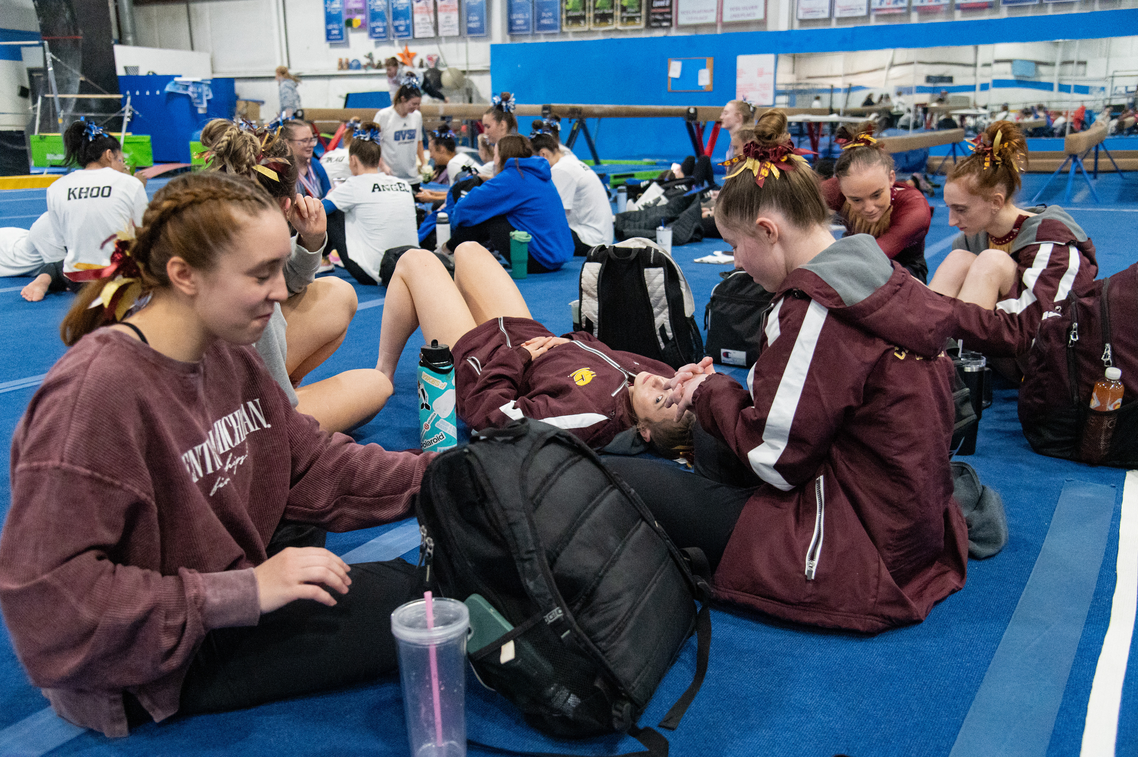CMU's club gymnastics team waits for the award ceremony to start at the end of Grand Valley State University’s Health Heart Classic meet, Saturday, Feb. 24, at Kids Unlimited Activity Center, Jenison, Mich.