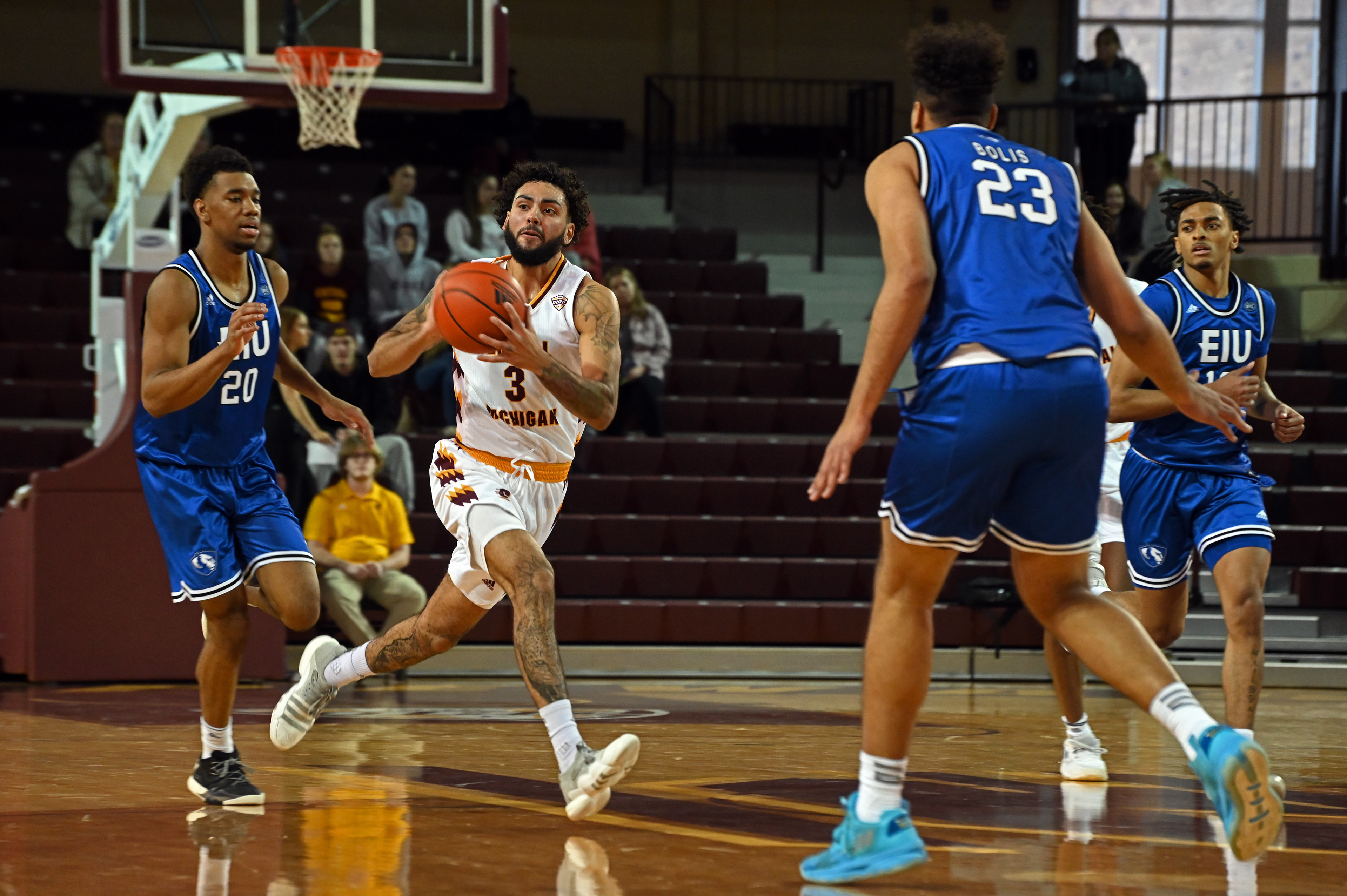 Junior guard Jesse Zarzuela passes the ball during a game against Eastern Illinois Sunday, Nov. 13 in McGuirk Arena.