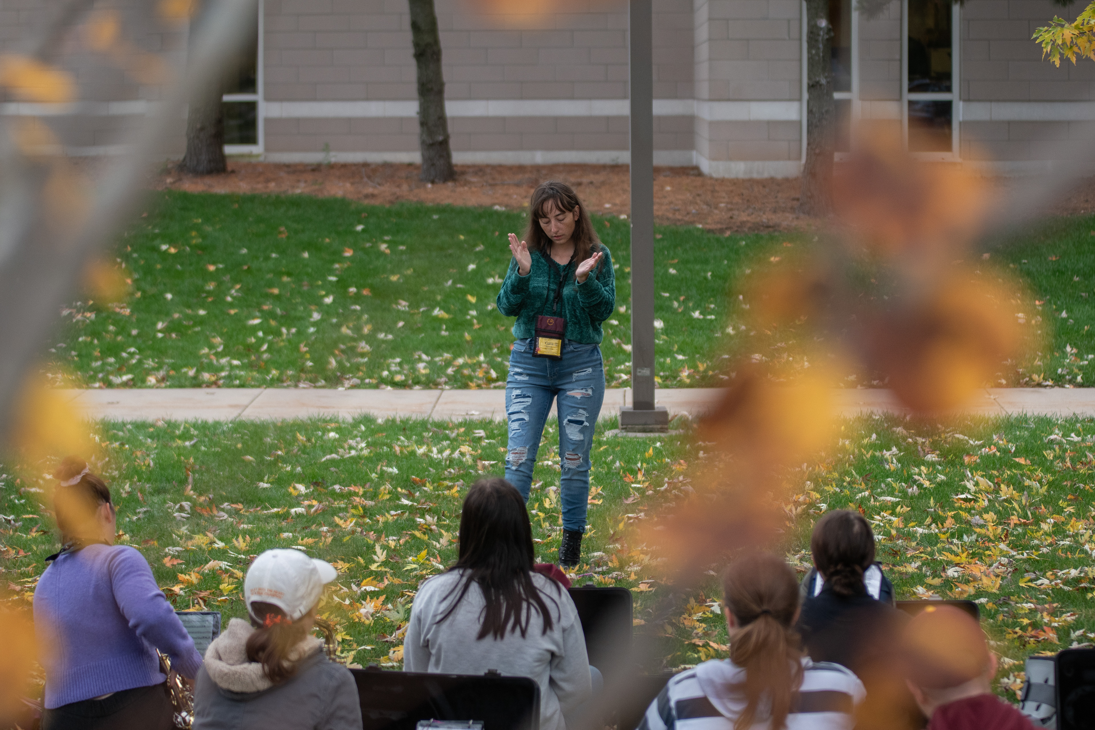 Gaia leads a group of alto saxophones during sectional practice in front of the Music Building, on the campus of Central Michigan University, Mount Pleasant, Michigan, Thursday, October 26, 2023. Gaia serves as rank captain for the alto saxophones.