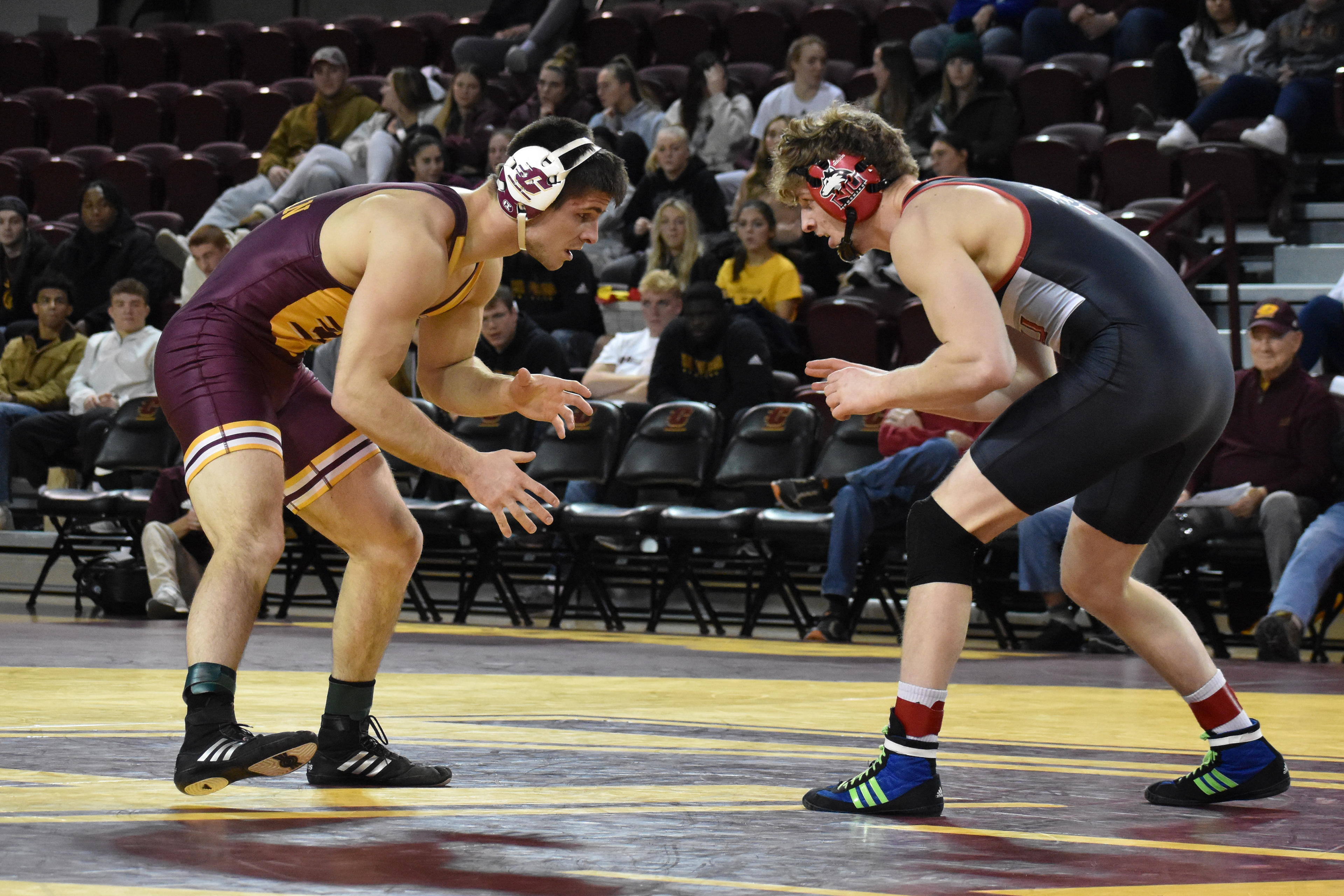 Flushing redshirt senior Ben Cushman wrestles during a match against Northern Illinois University Friday, Jan. 13 in McGuirk Arena. Cushman was 8-12 going into the match.