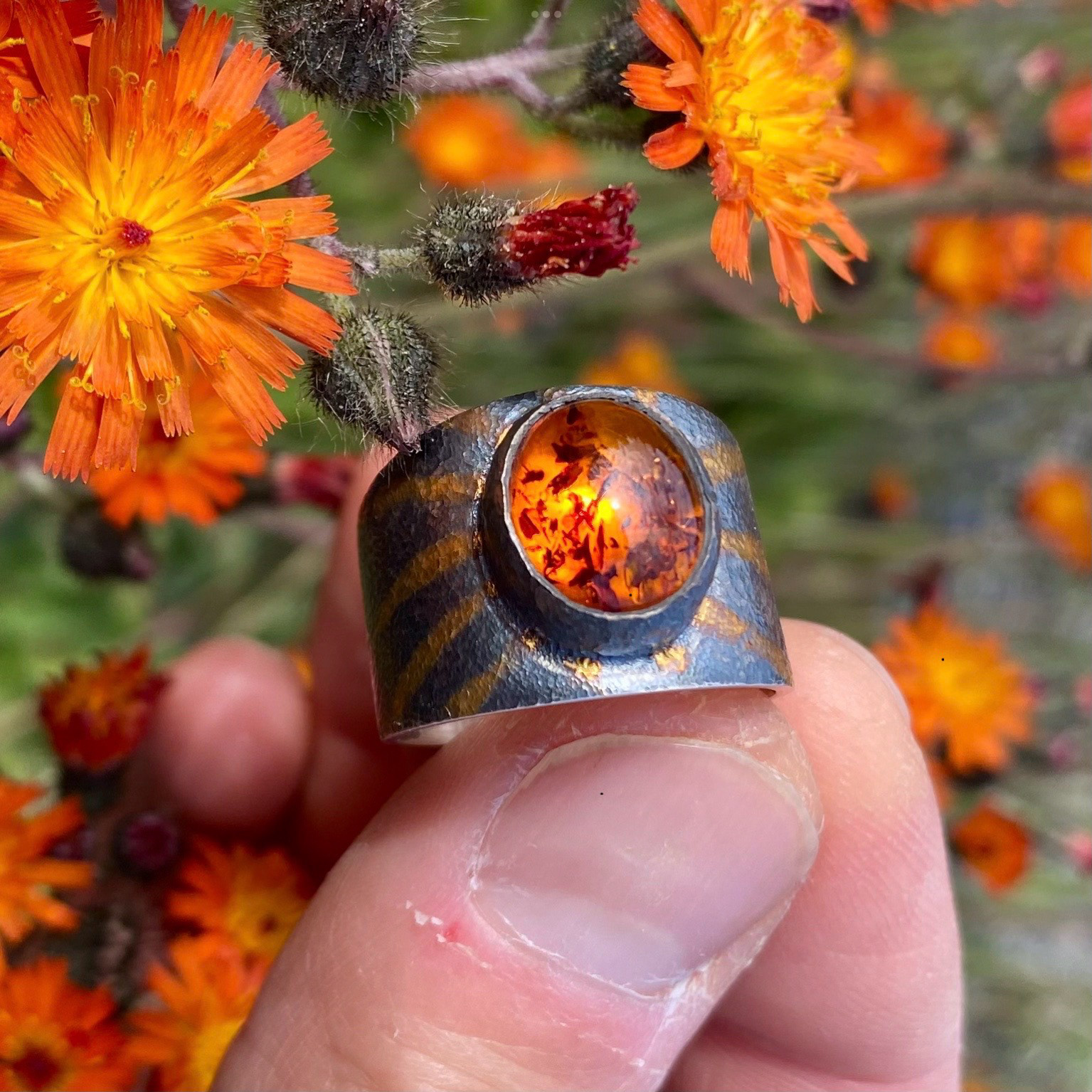 Sterling silver ring with amber and gold accents