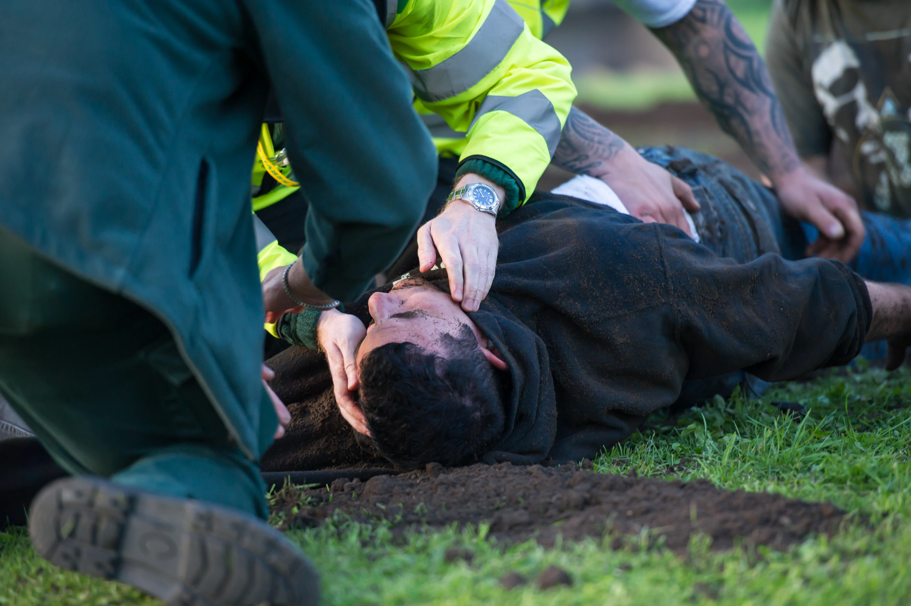 Medics attend to Antony Britton who was rescued after been buried alive 