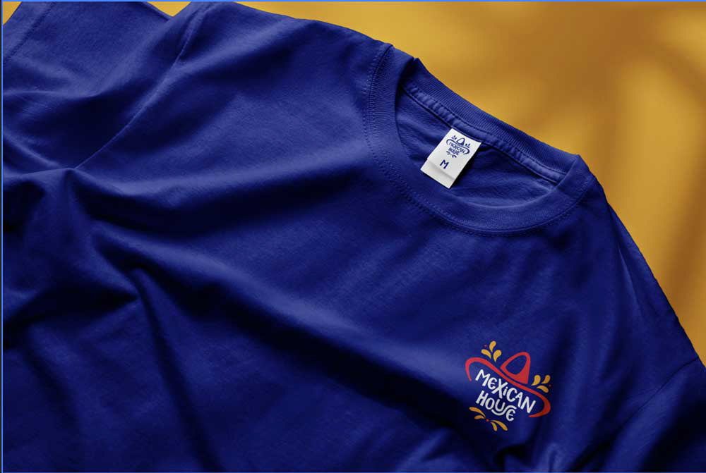 Yellow background with blue shirt and small Mexican House logo