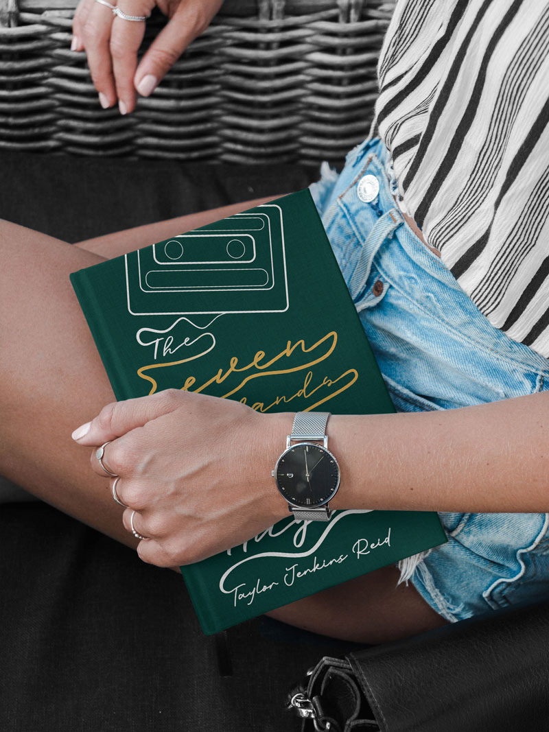 Woman holding the redesigned book cover