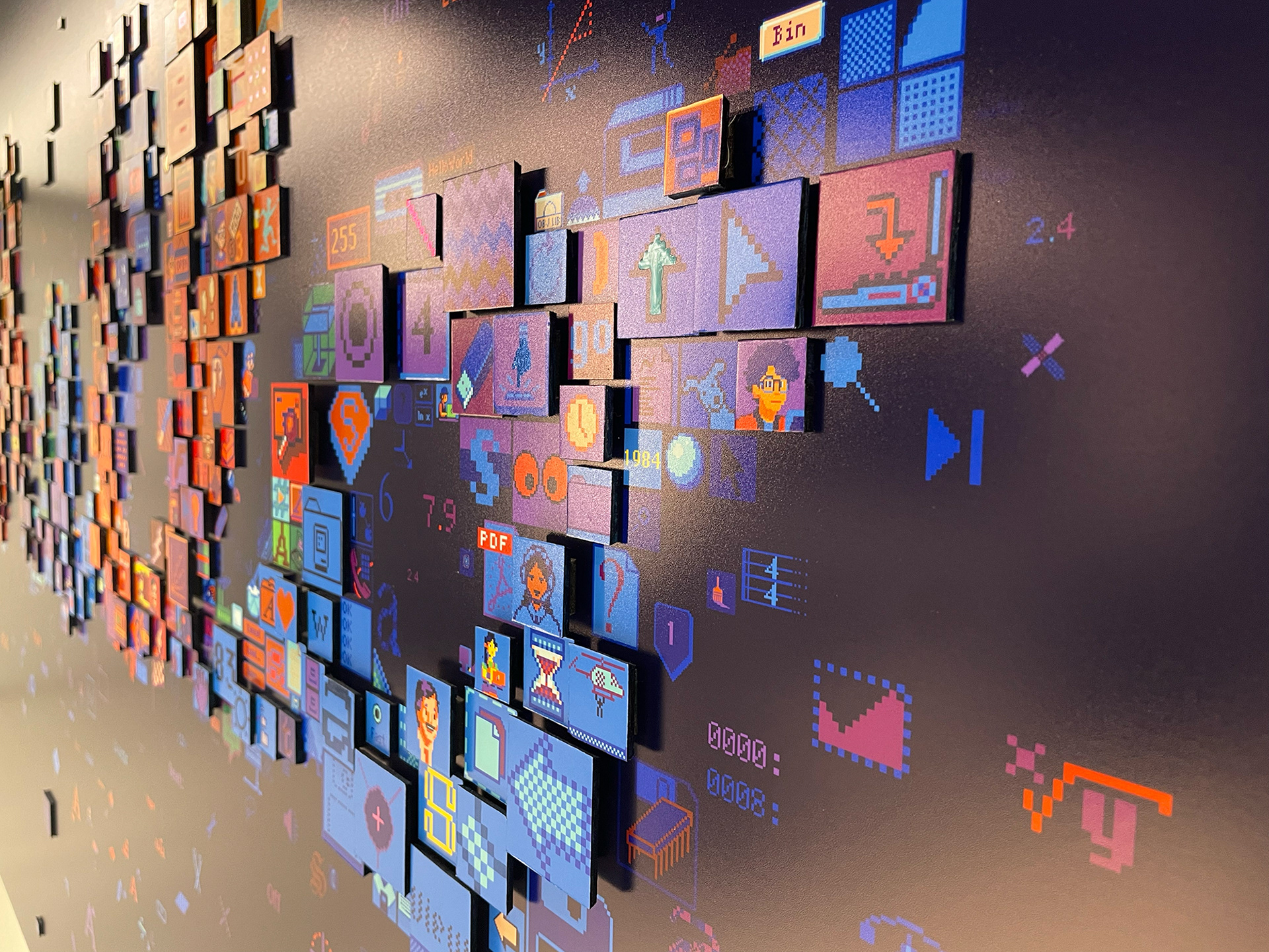 Close-up of digital mosaic artwork for Apple headquarters featuring interface elements from Apple history