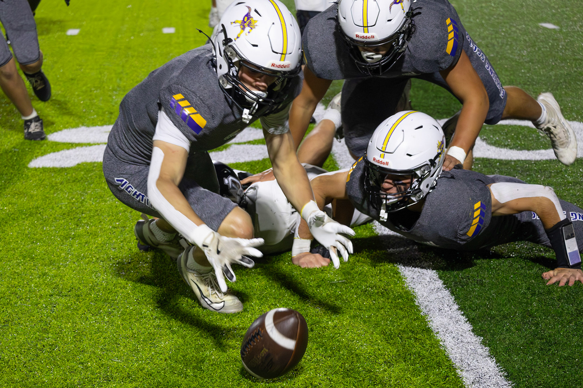 Logan Pratt spots a fumble by a West Ottowa Panther and dives to the ball. Every turnover has a story, this one had Pratts name on it. (Photo by Khloe Lowande)