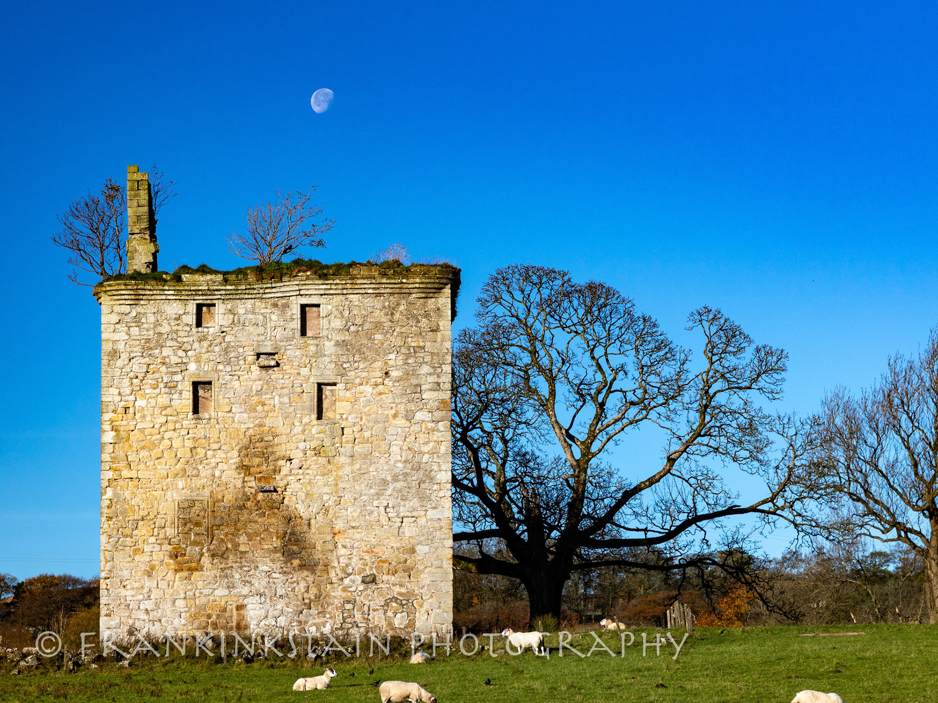 Moon setting behind Barr Castle