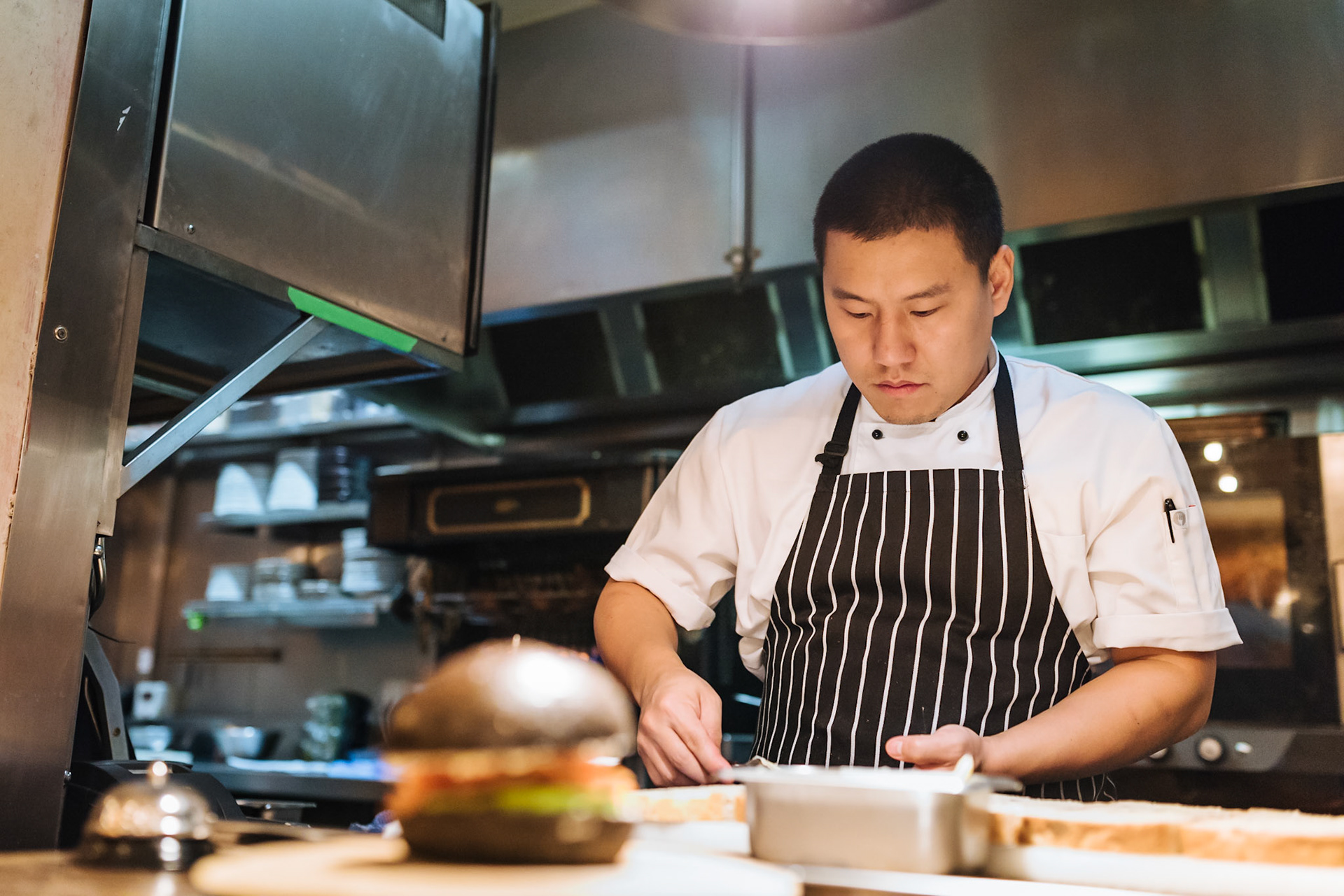 Chef prepairing food in commercial kitchen