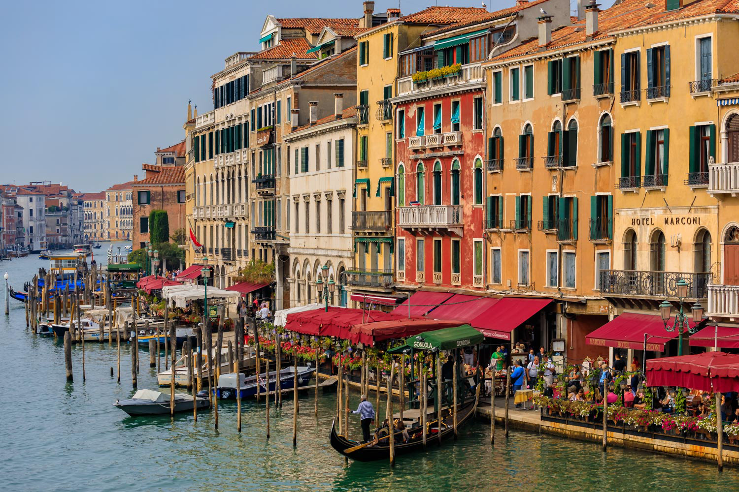 Gondolas along buildings on Grand Canal of Venice Italy