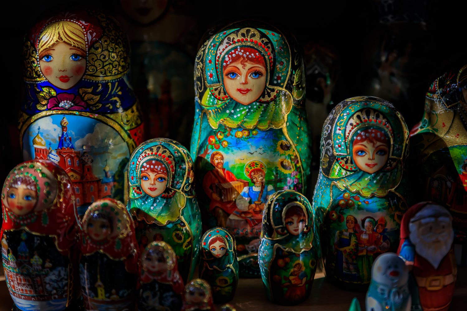 Colorful traditional Russian matryoshka nesting dolls in a souvenir shop in Saint Petersburg Russia with a dramatic high contrast lighting