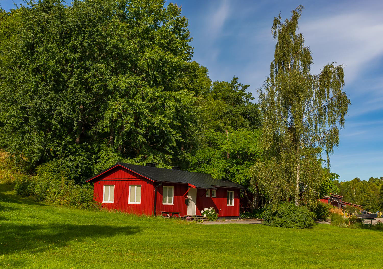 Traditional old house surrounded by trees in Stockholm Sweden