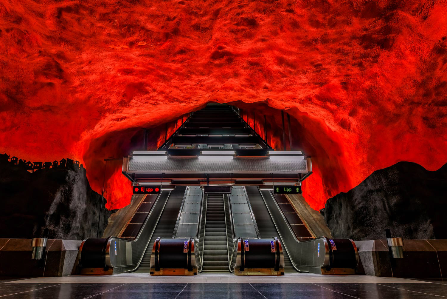 Stockholm metro or tunnelbana station Solna Centrum with fire like wall designs