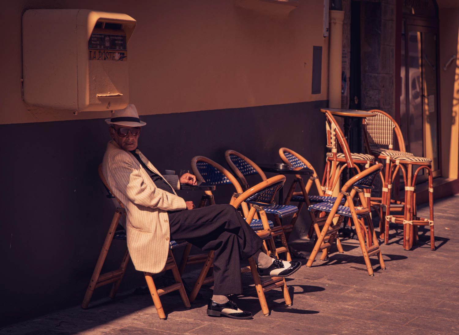 Stylish gentlemen at a cafe in the French Riviera city of Nice.